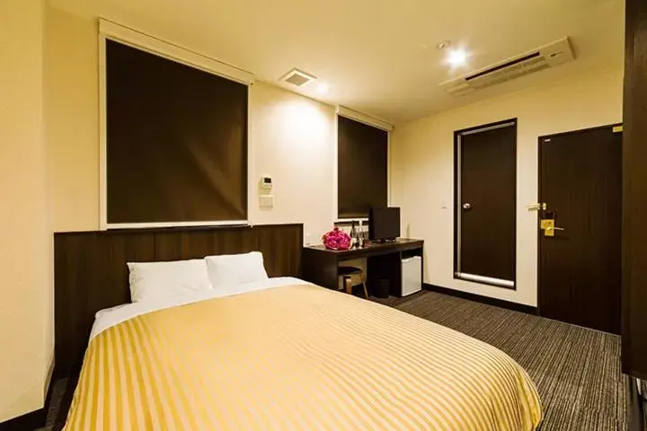 Bed in Hotel CASVI Tenjin