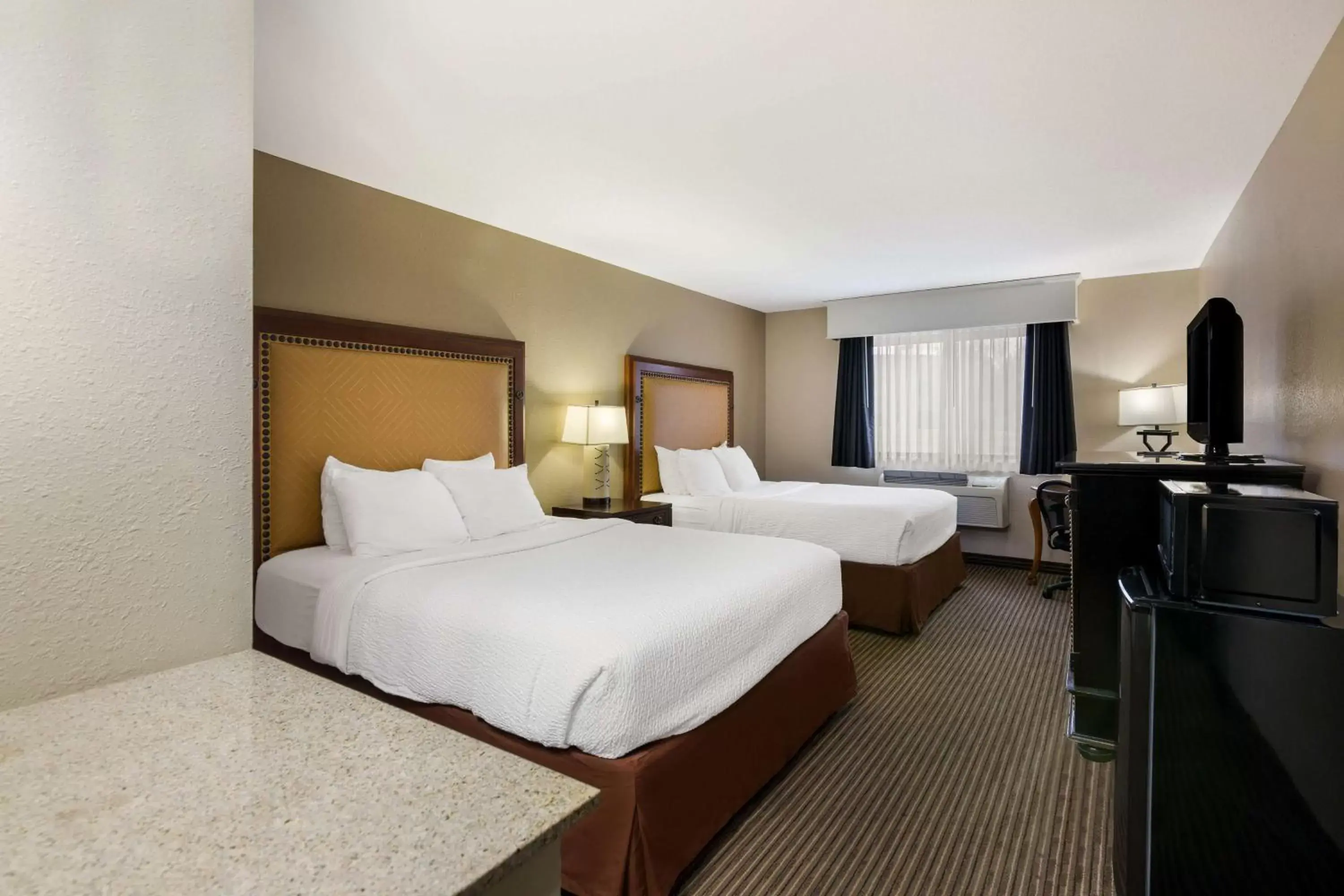 Bedroom in Revel Hotel Minot - SureStay Collection by Best Western