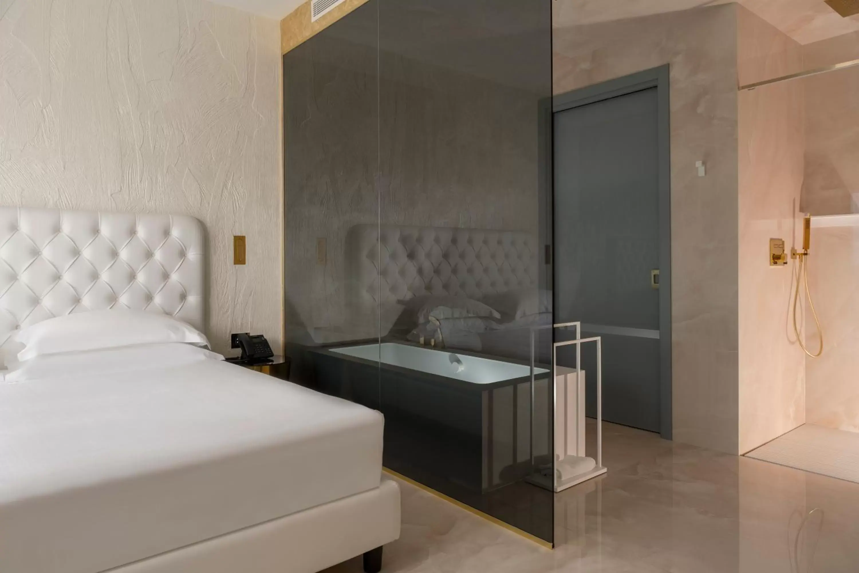 Bed in The Promenade Luxury Wellness Hotel