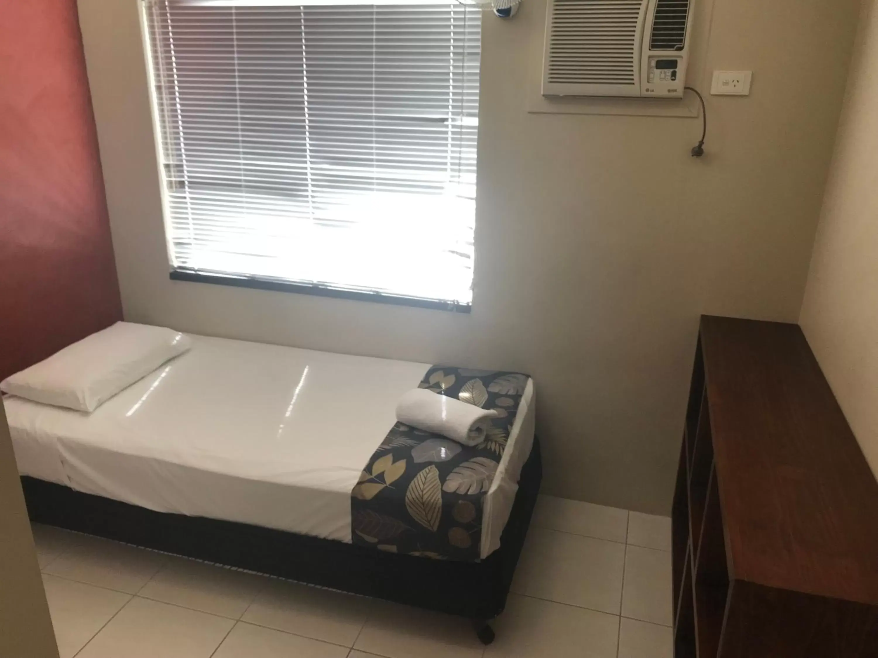 Bed in Reef Gateway Apartments