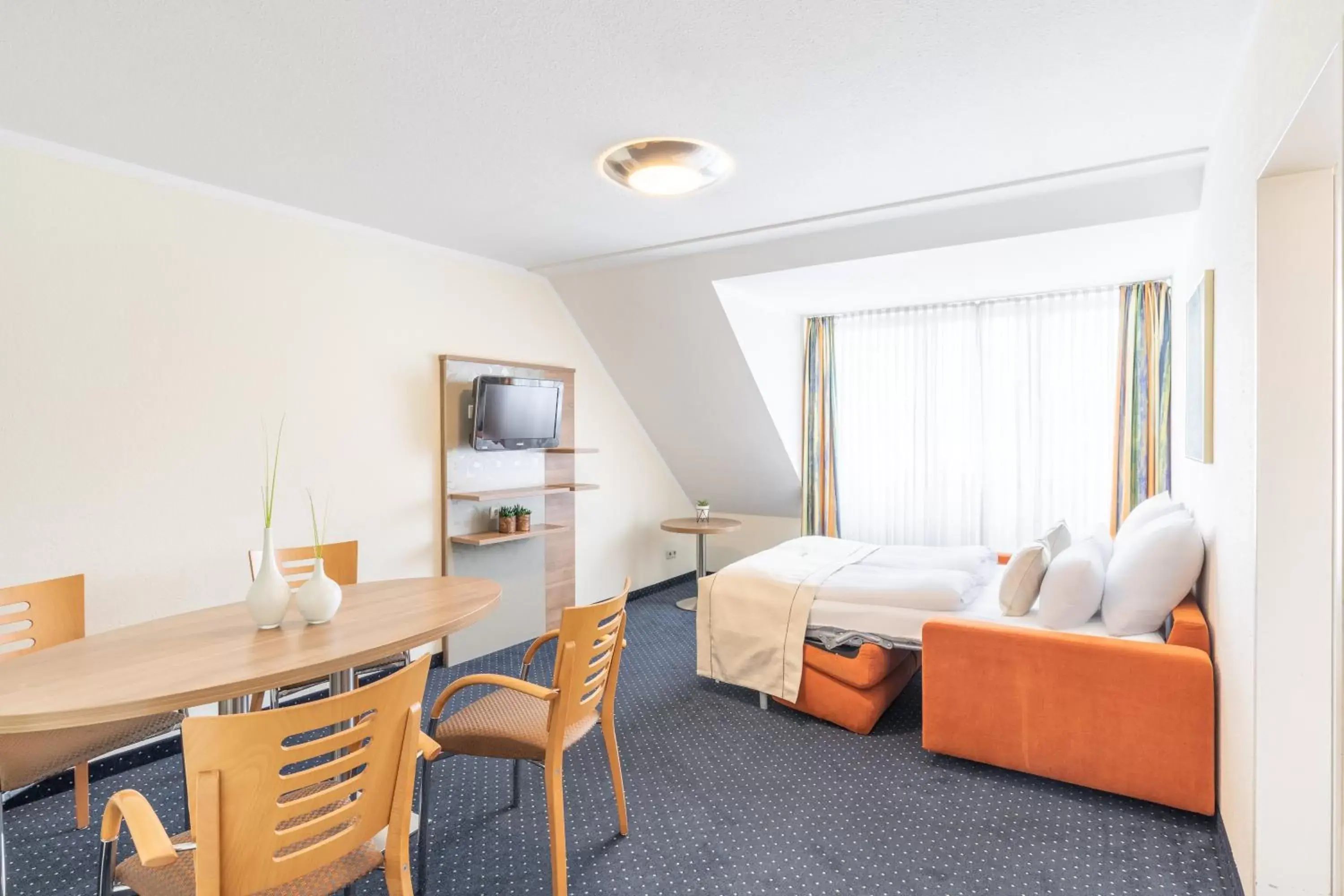 Bed, Seating Area in acora Bochum Living the City