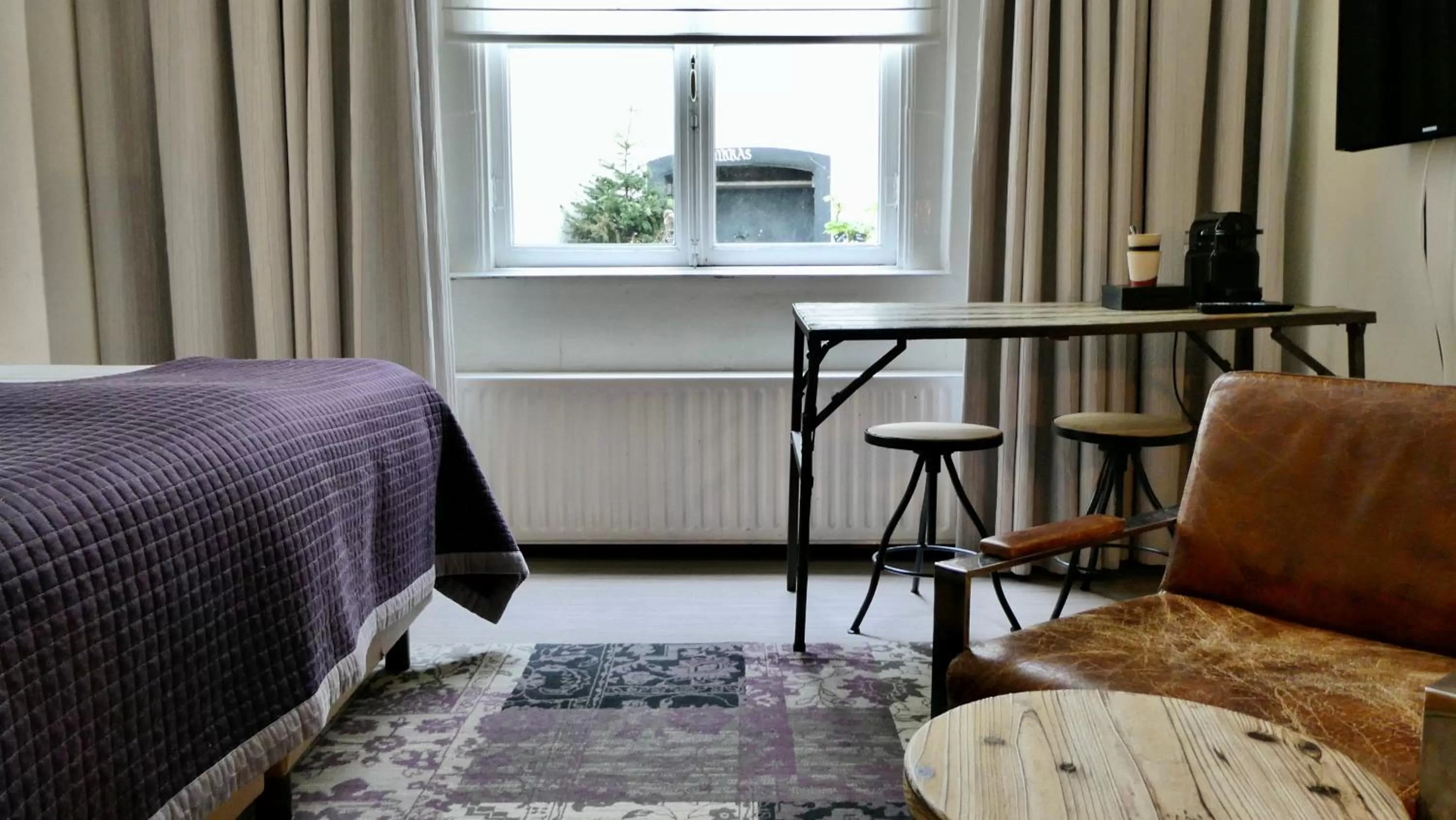 Seating area, Bed in BE41 Boutique Hotel