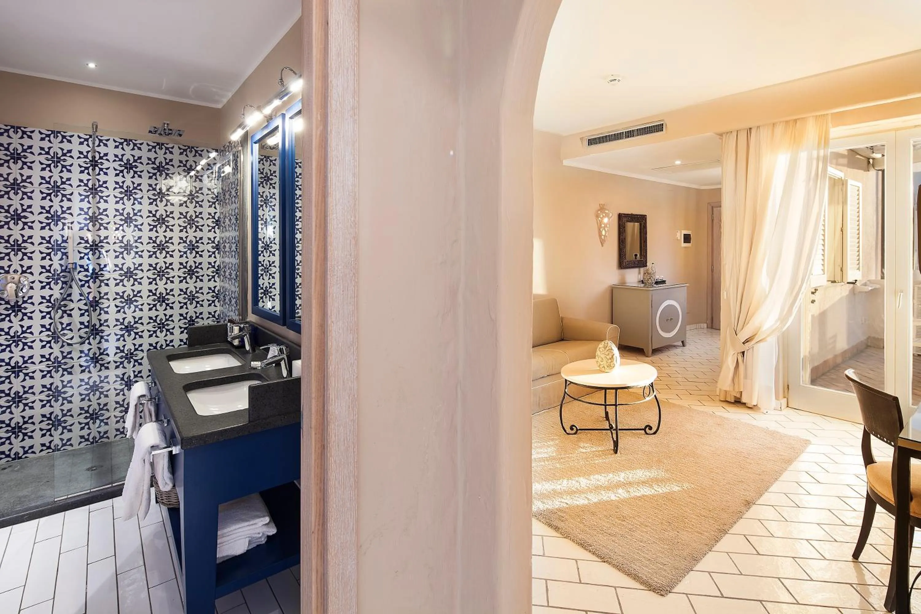 Bathroom in Therasia Resort Sea and SPA - The Leading Hotels of the World