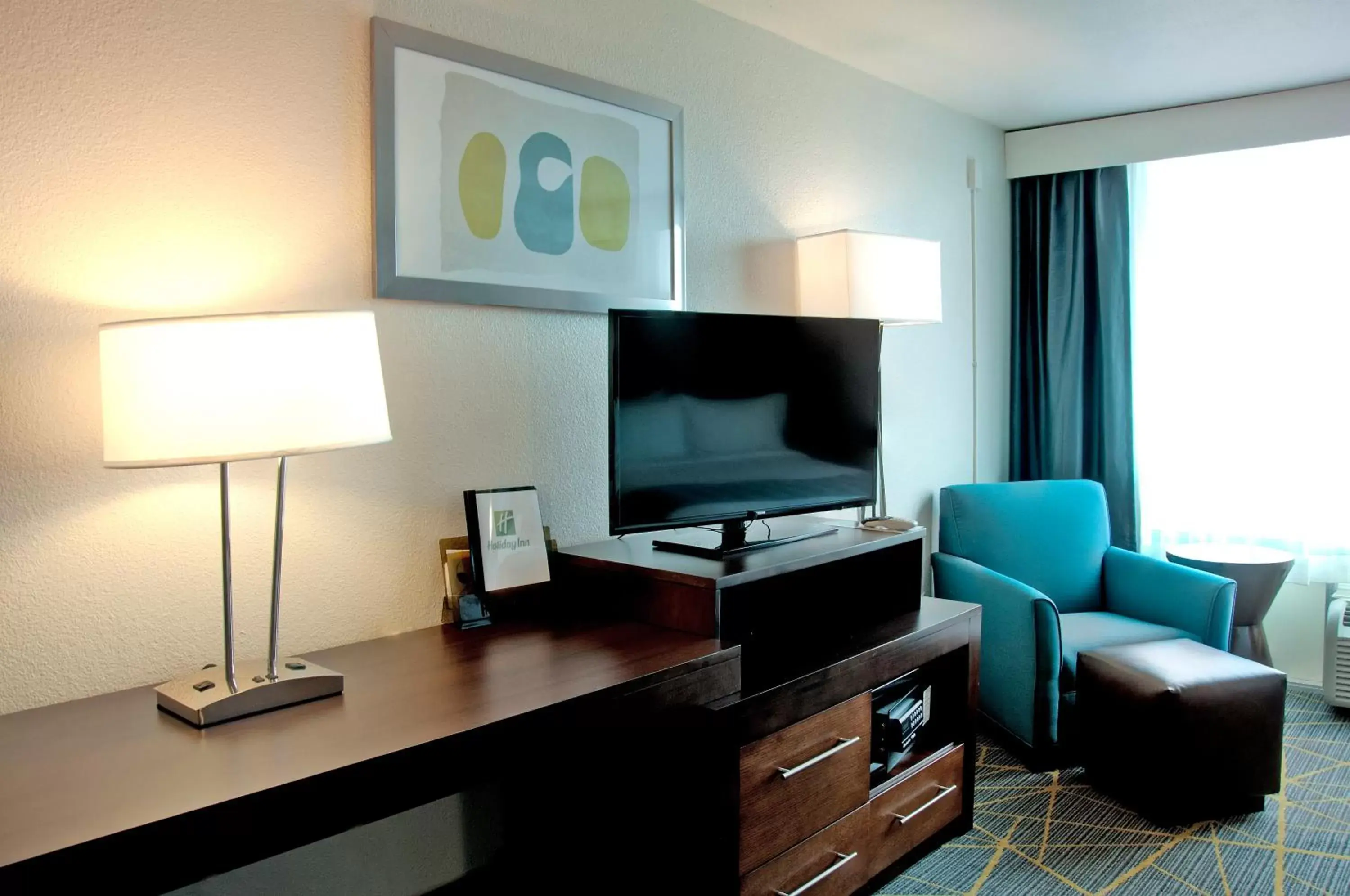 Photo of the whole room, TV/Entertainment Center in Holiday Inn Victorville, an IHG Hotel