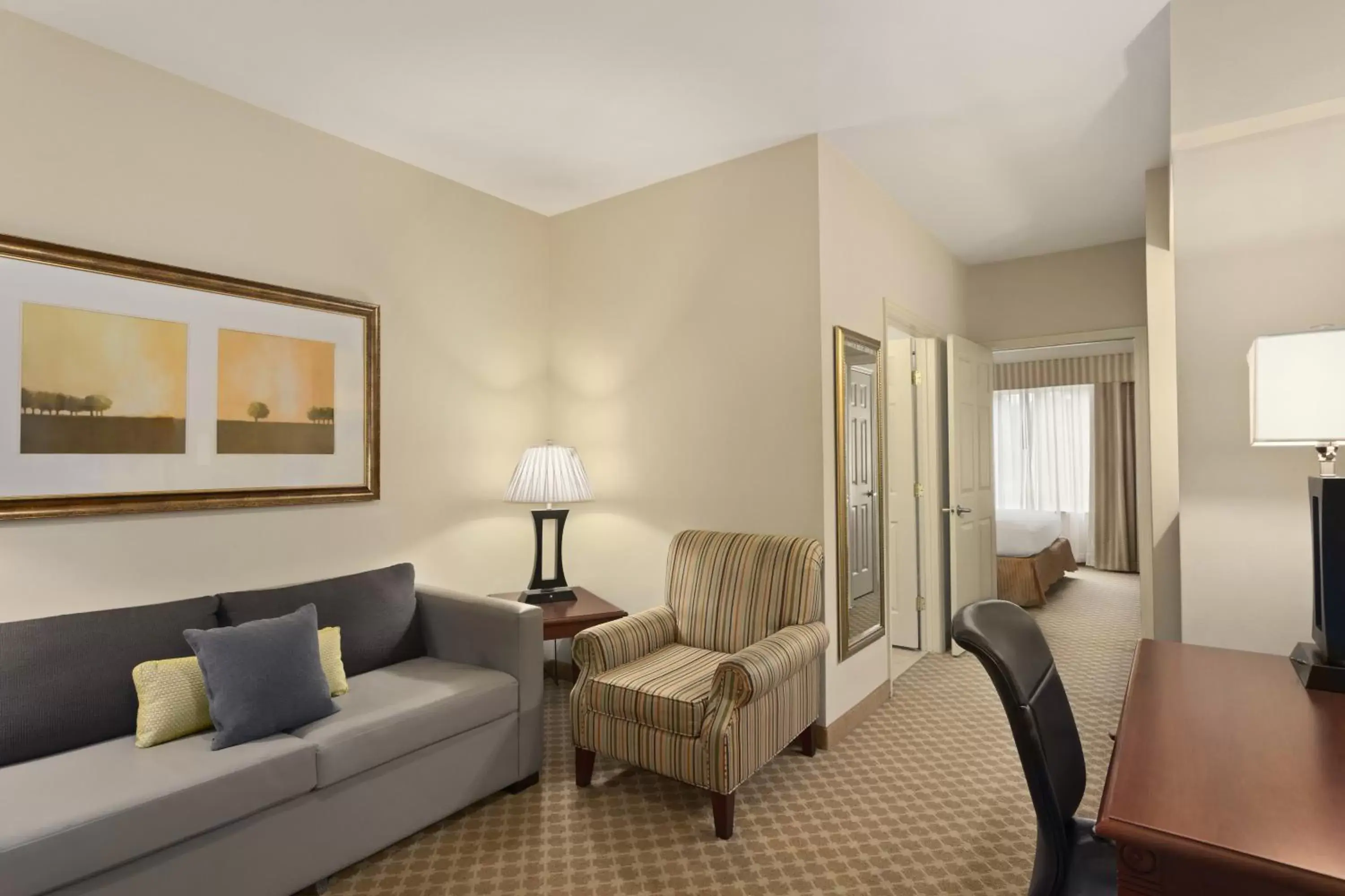 Living room, Seating Area in Country Inn & Suites by Radisson, Saraland, AL