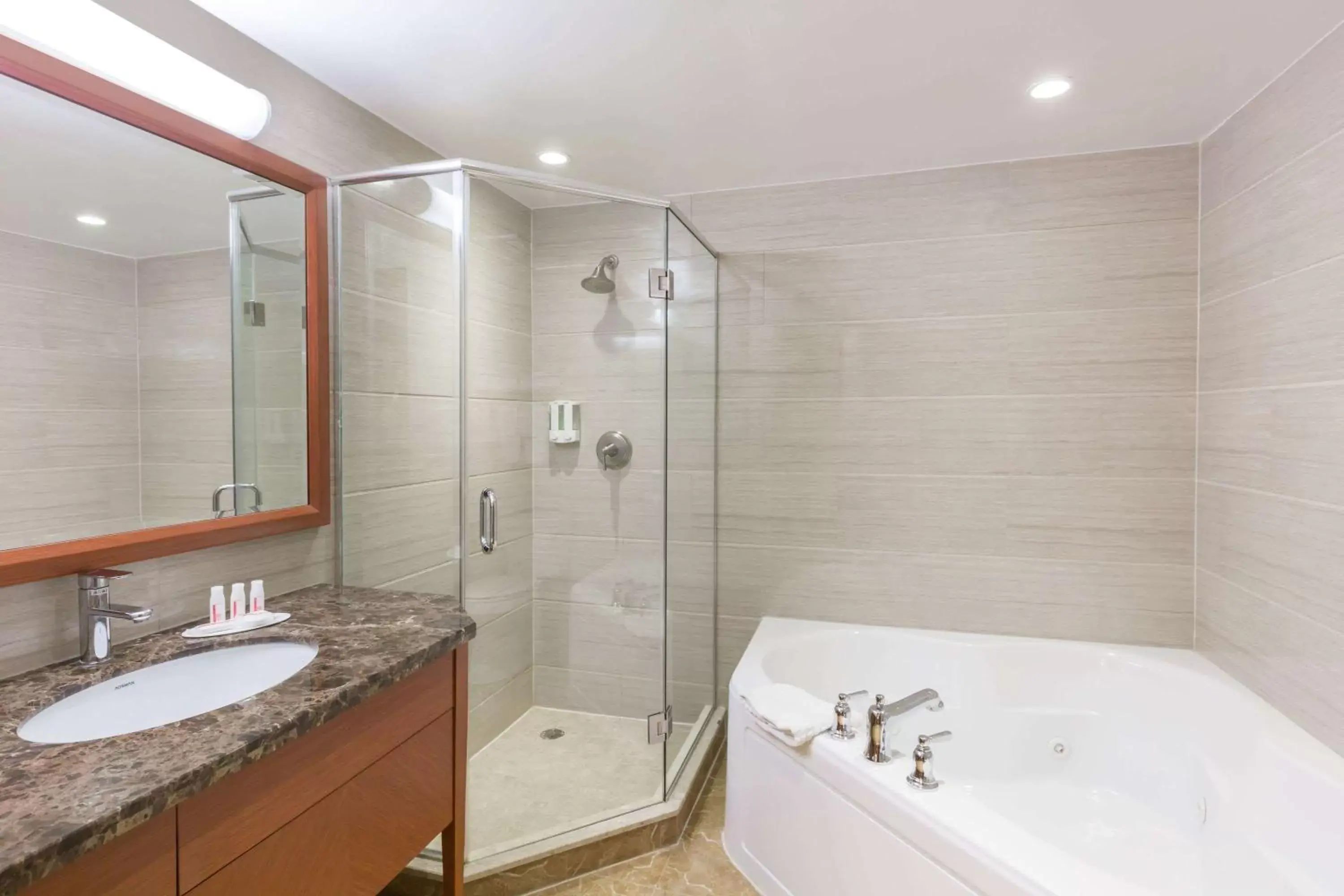 Bathroom in Ramada by Wyndham Flushing Queens