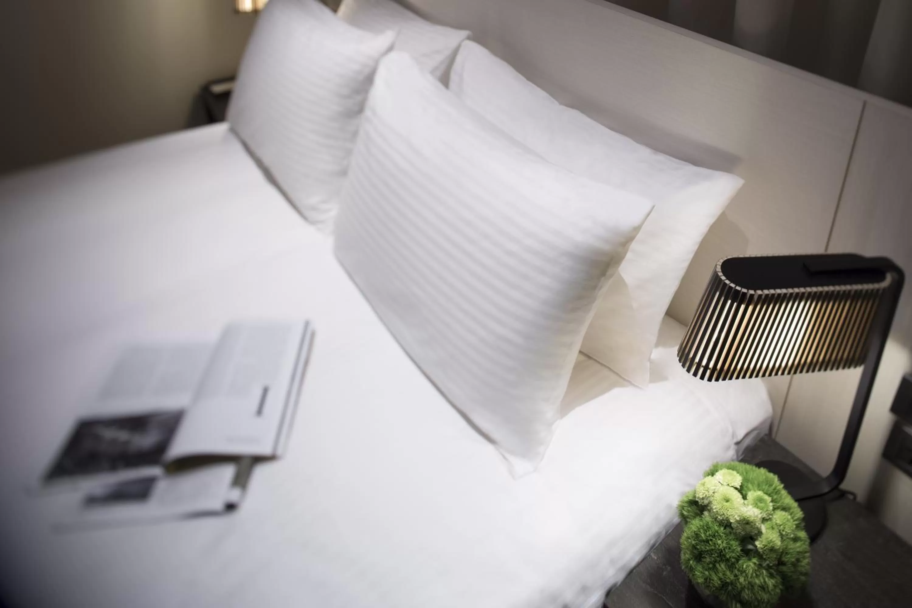 Bed in Riverview Suites Taipei