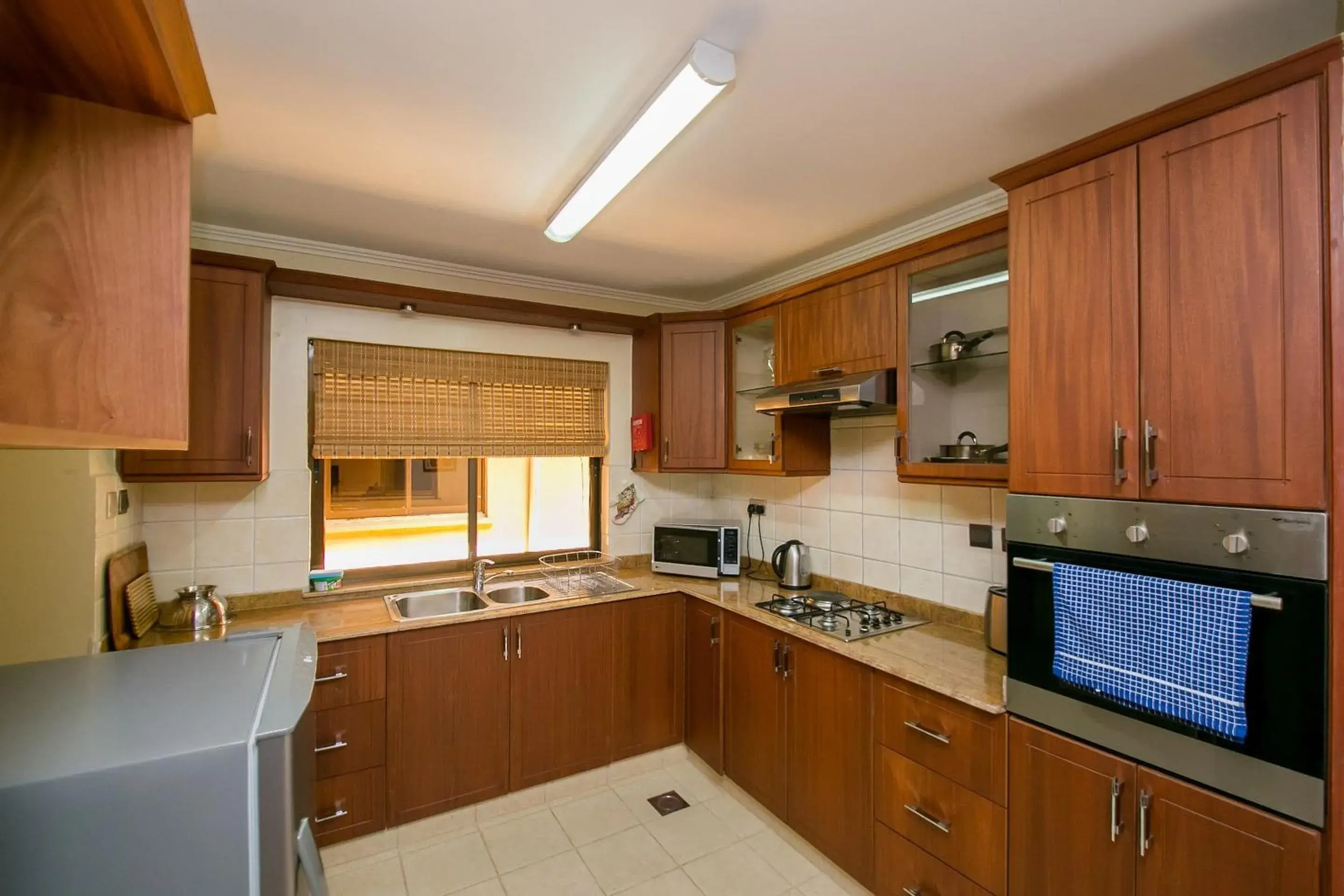 Kitchen or kitchenette, Kitchen/Kitchenette in Waridi Paradise Hotel and Suites