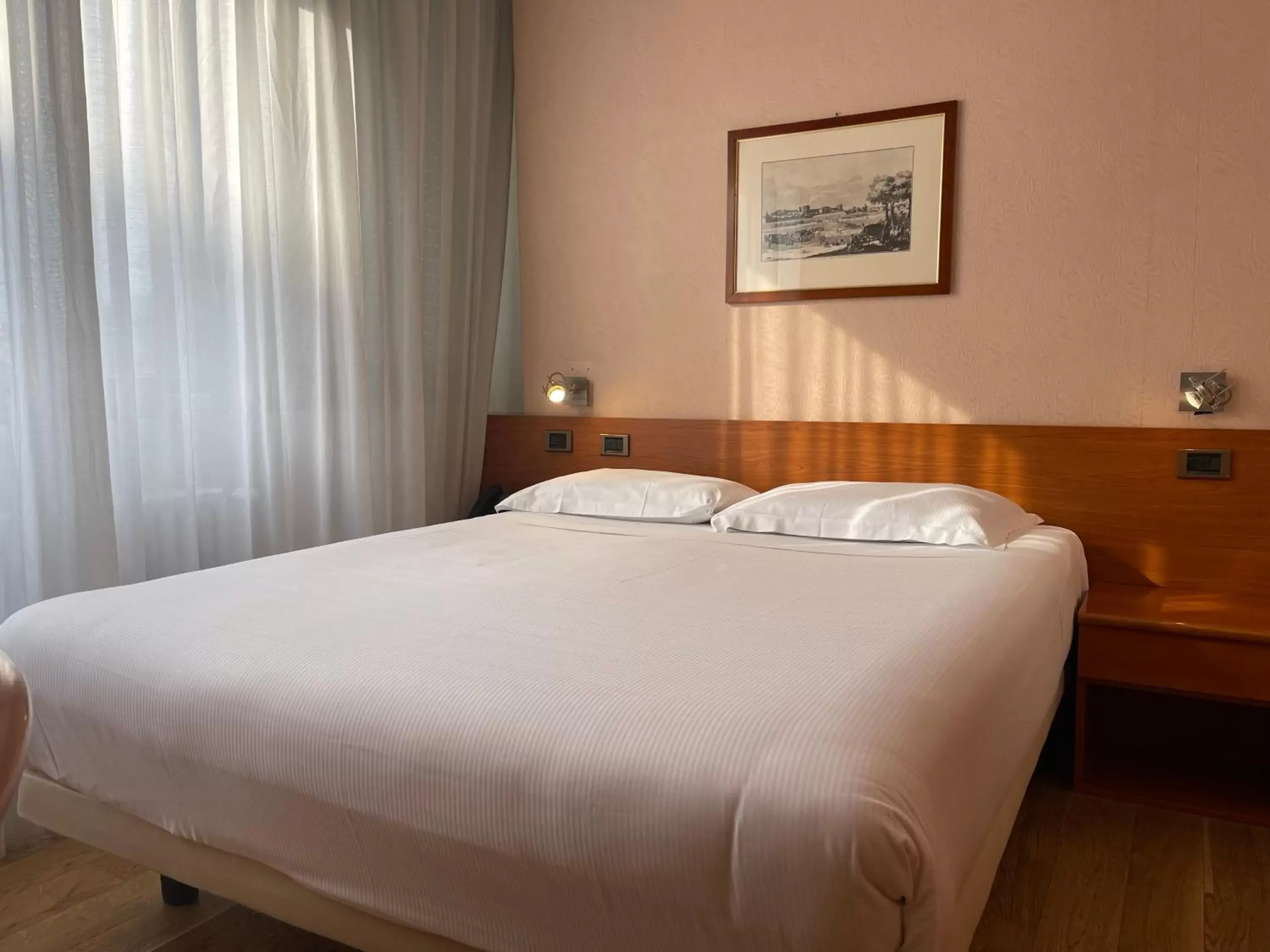Bed in Crystal Hotel Varese