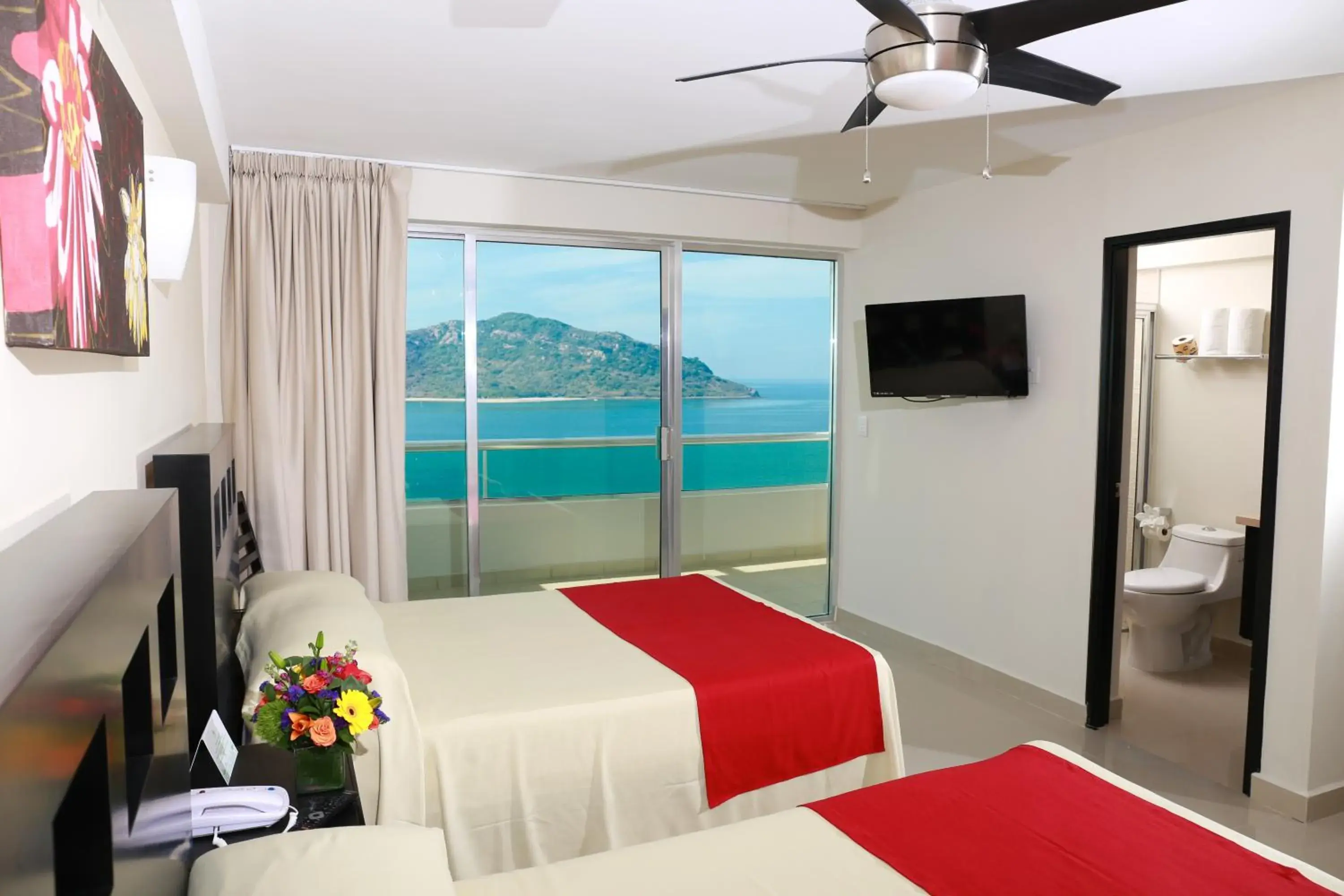 Photo of the whole room, Bed in Las Flores Beach Resort Photo of the whole room, Bed in Las Flores Beach Resort