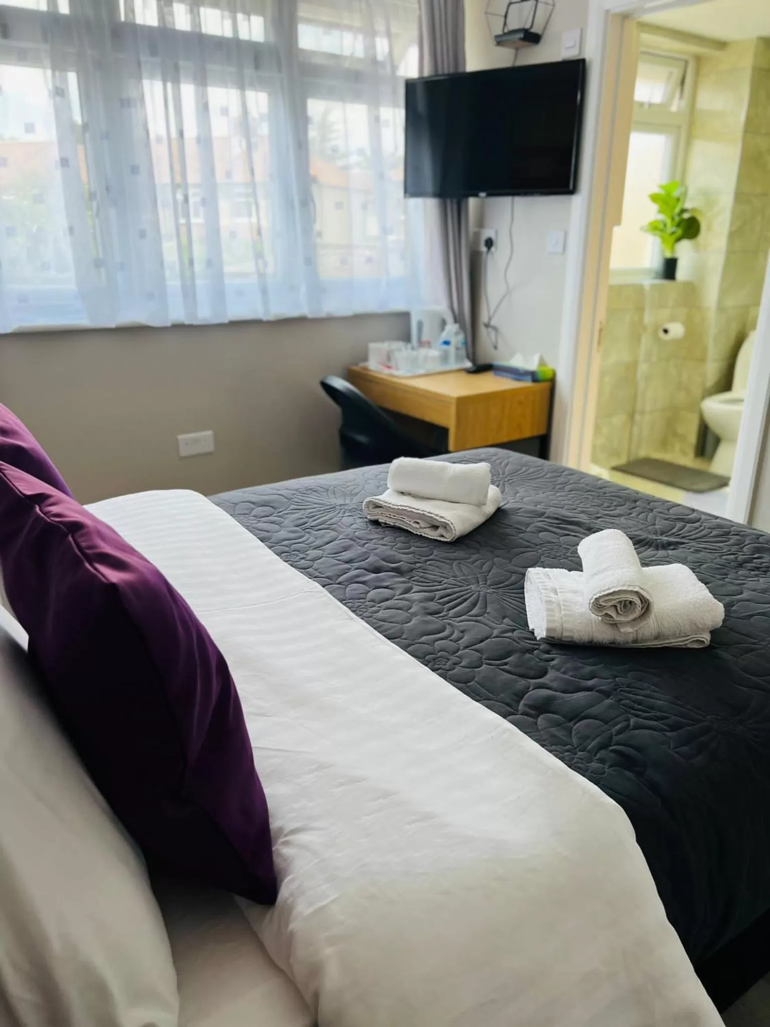 Photo of the whole room, Bed in Indigo Suites