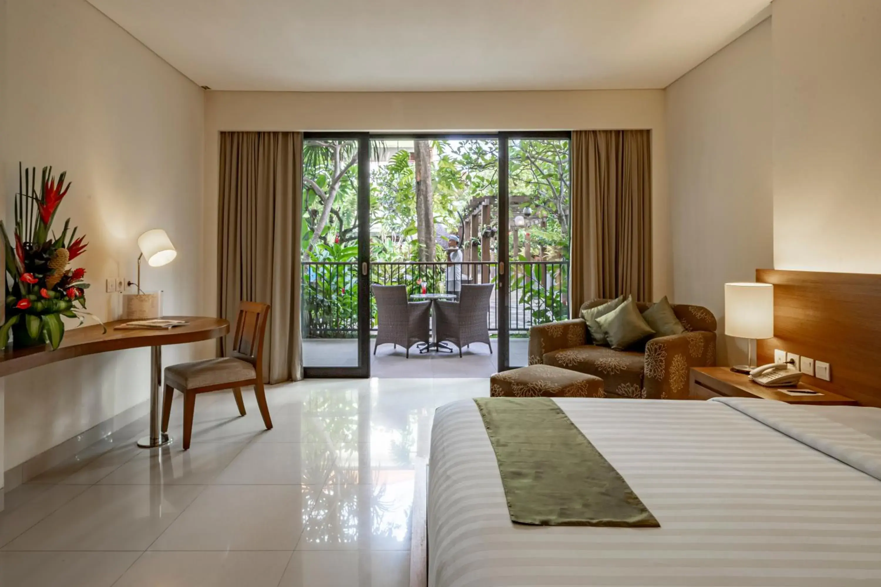 Bed, Seating Area in Taksu Sanur Hotel