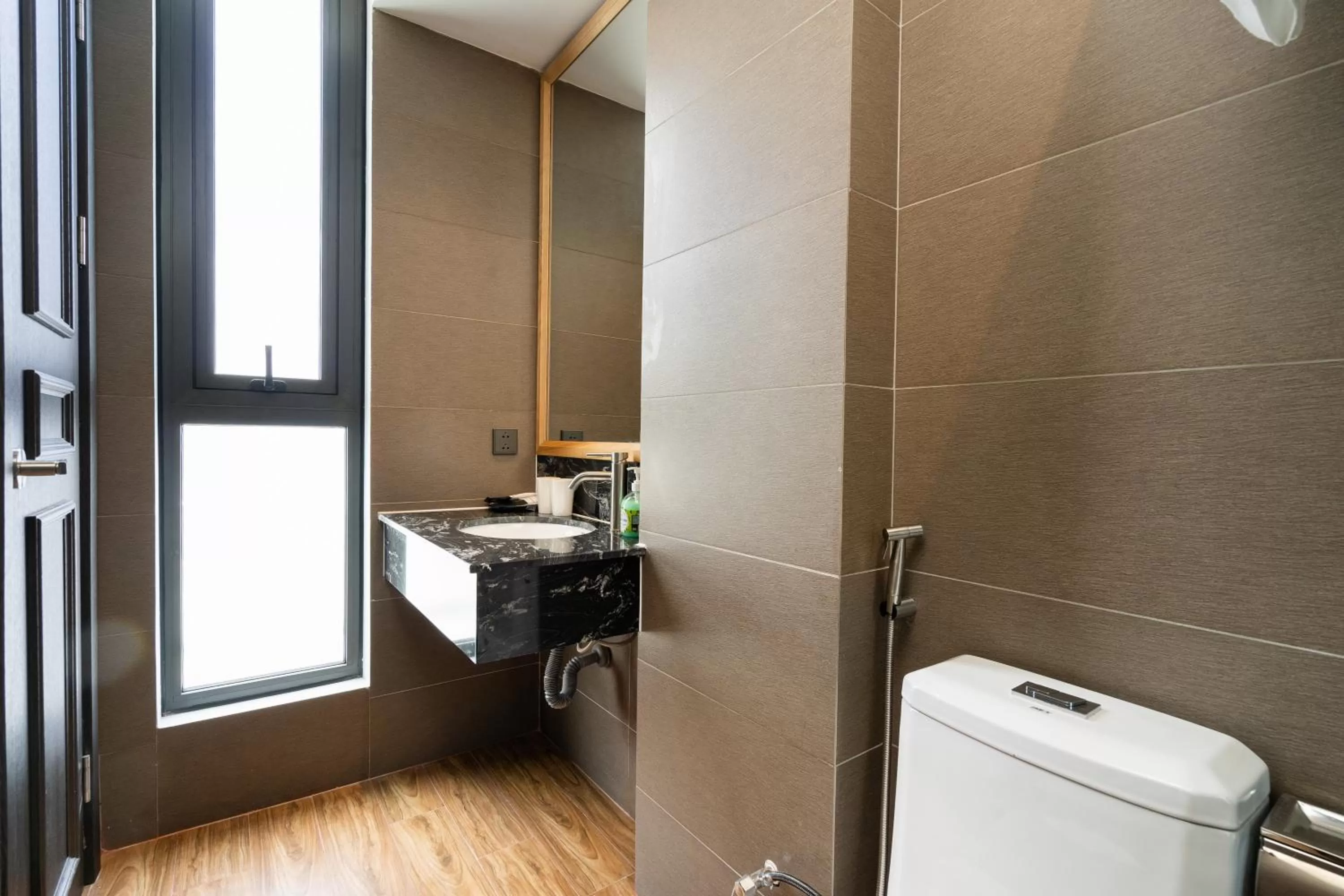 Toilet in Haven Hut Hotel