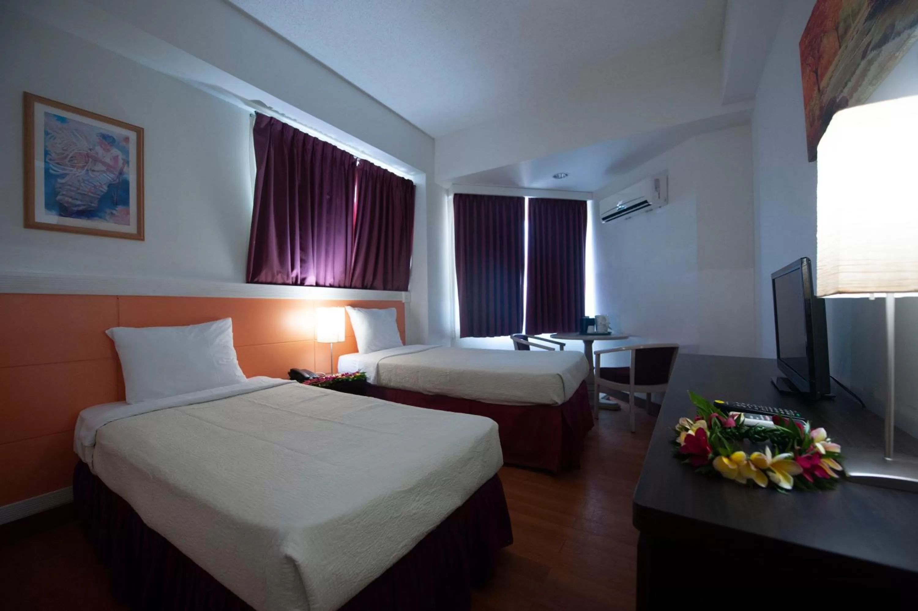 Bed in Grand Plaza Hotel