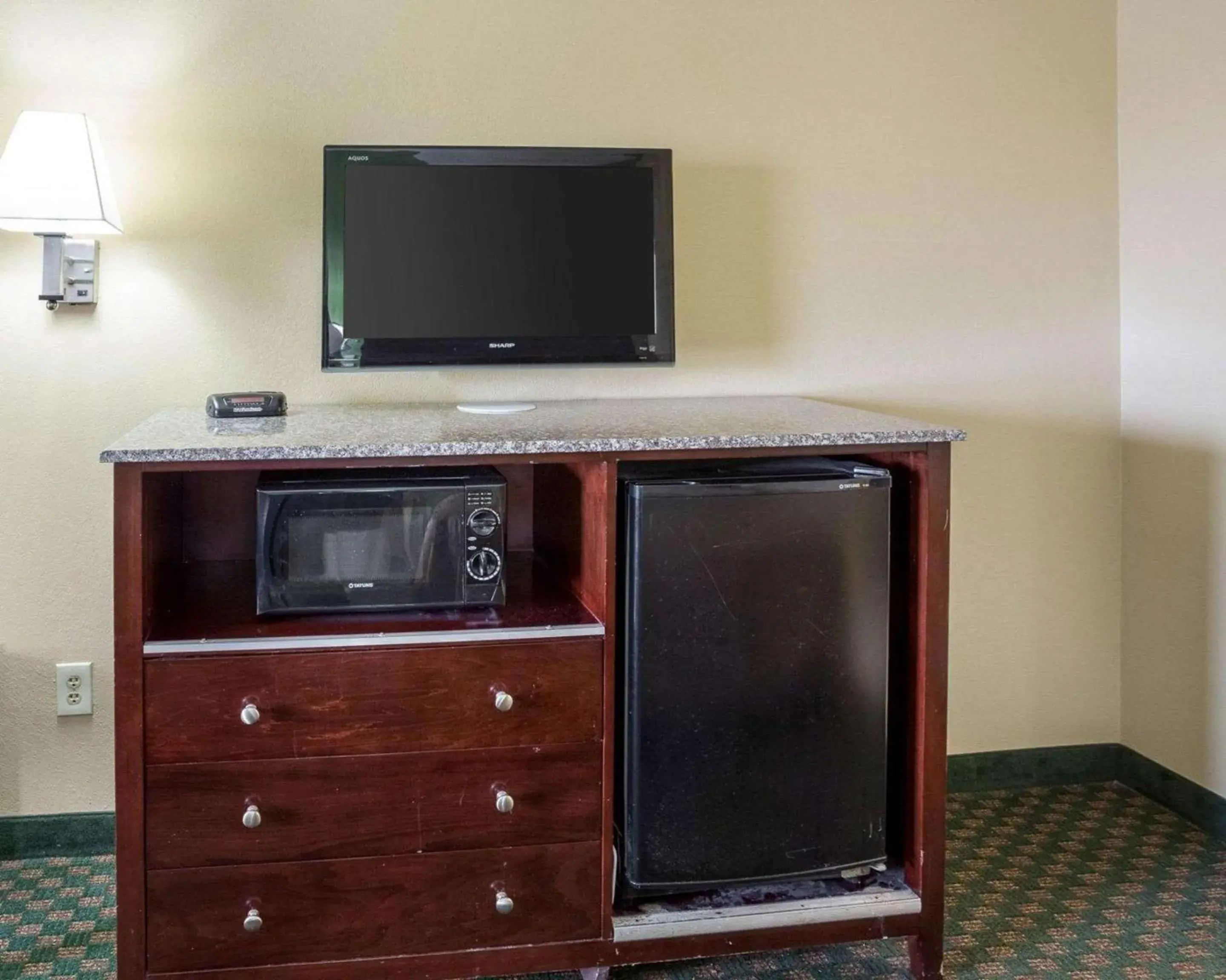 Photo of the whole room, TV/Entertainment Center in Rodeway Inn & Suites