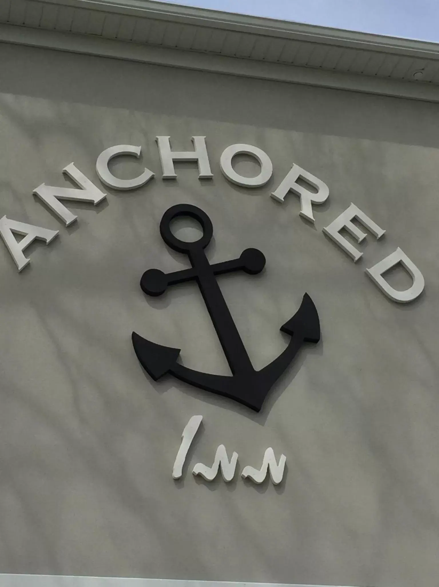 Property logo or sign in Anchored Inn at Hidden Harbor