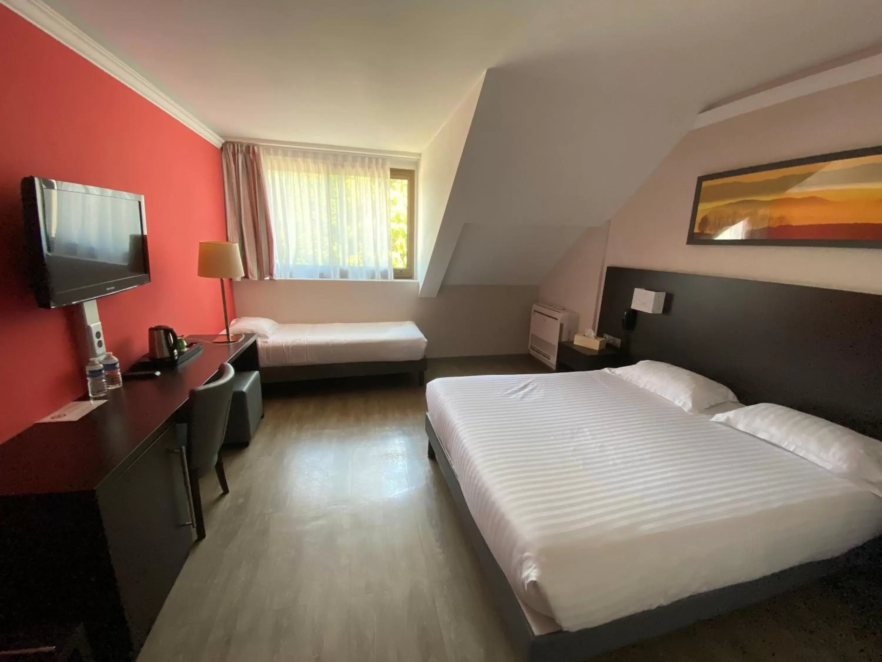 Bedroom, TV/Entertainment Center in Logis Hotel Restaurant Black and Green Limoges Sud Bedroom, TV/Entertainment Center in Logis Hotel Restaurant Black and Green Limoges Sud