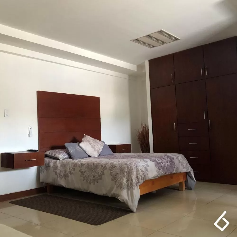 Bed in Departamentos Bonsai