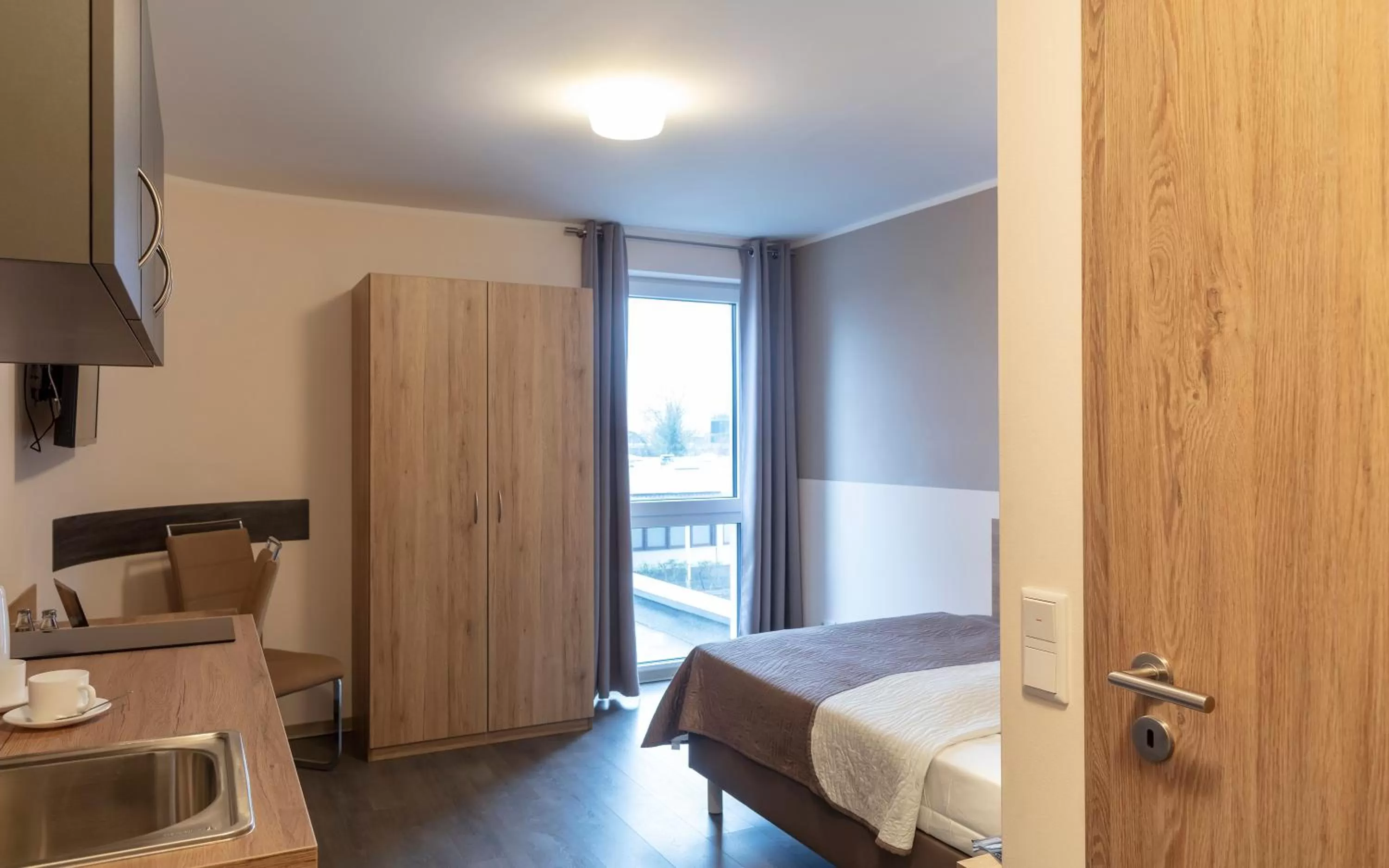 Photo of the whole room, Bed in Dominik Hotel & Eventsaal