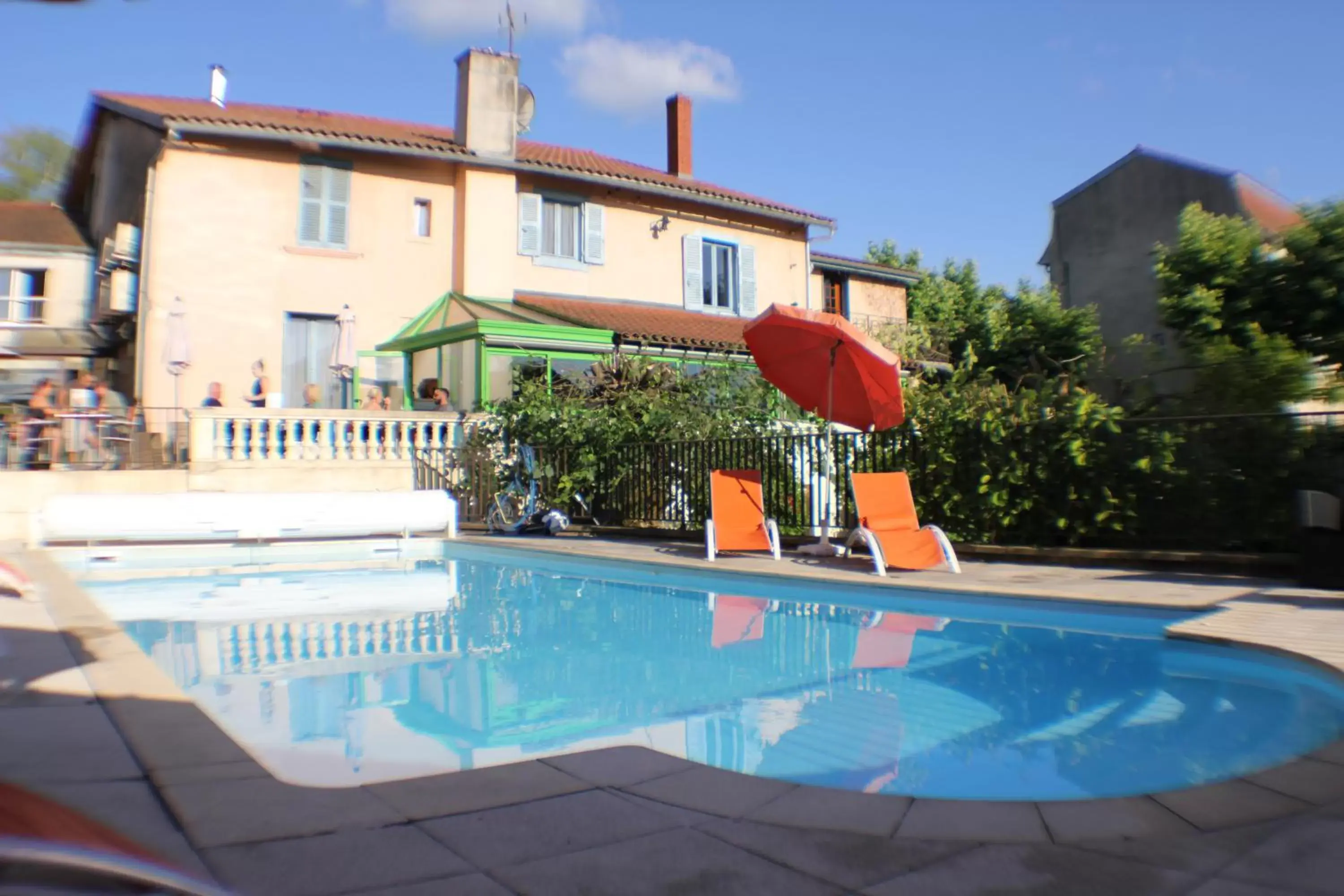 Swimming Pool in Logis Hôtel Restaurant Vuillot