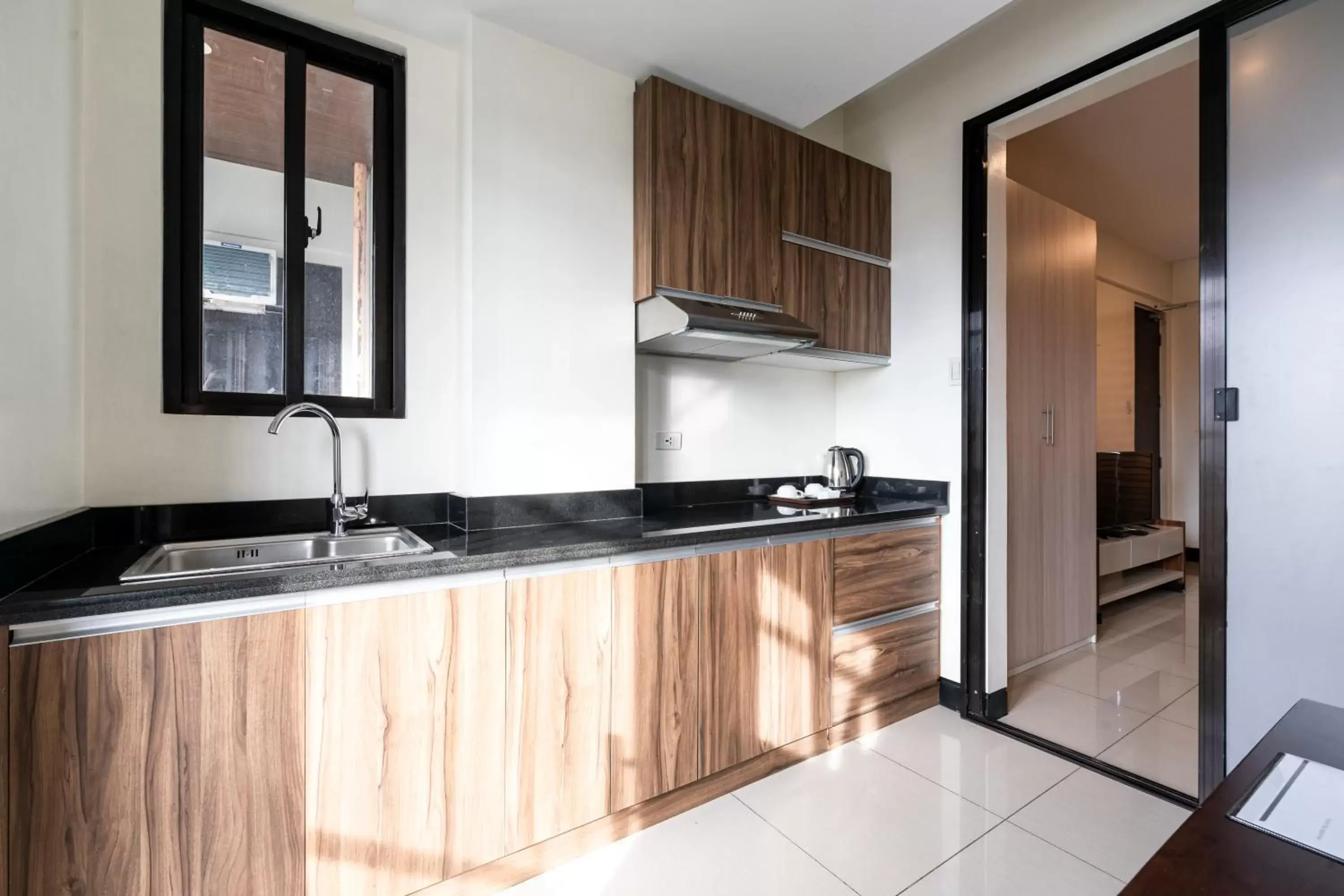 Kitchen/Kitchenette in Artemis Place Makati Hotel