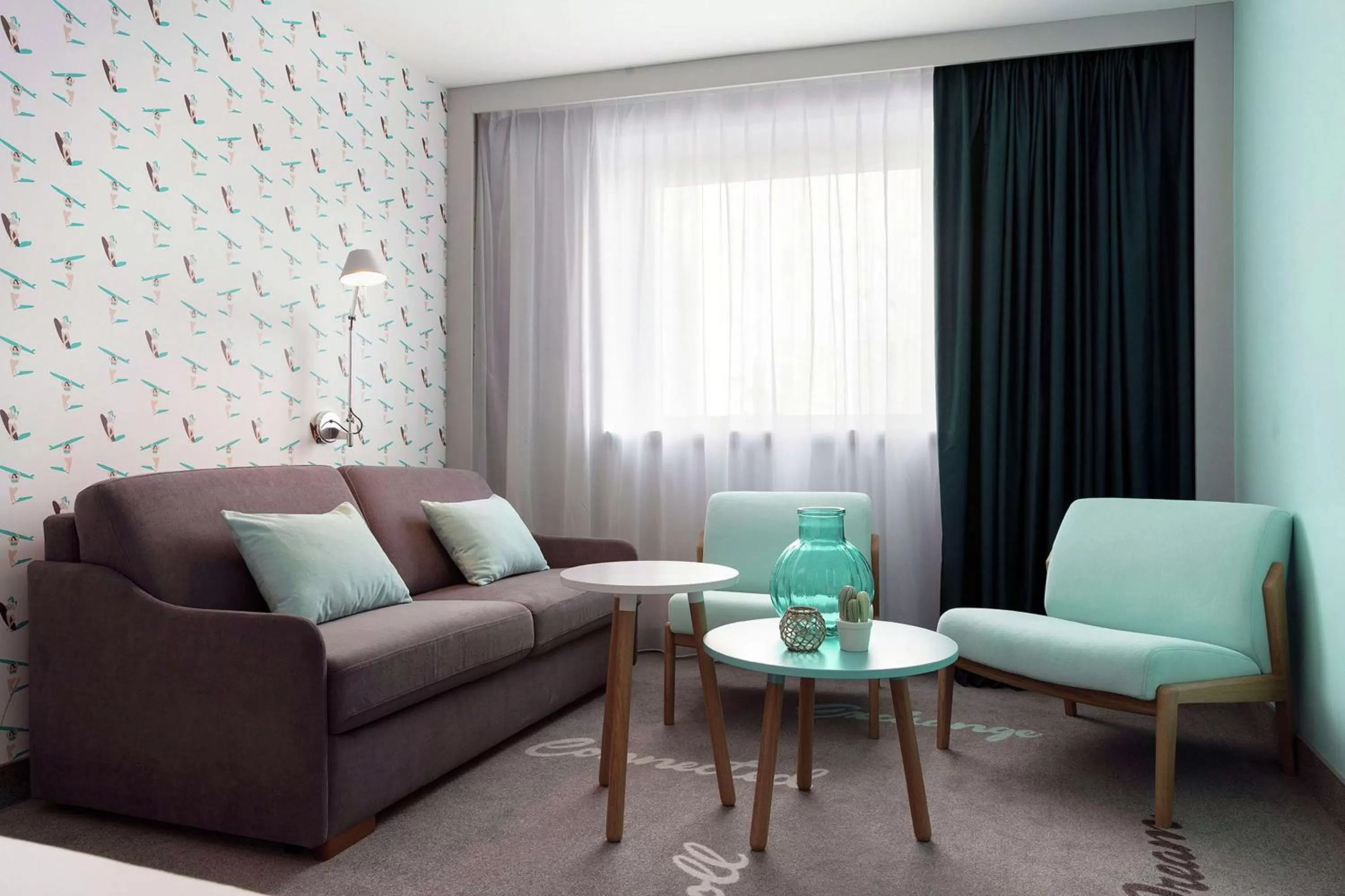 Living room in Hampton By Hilton Paris Clichy