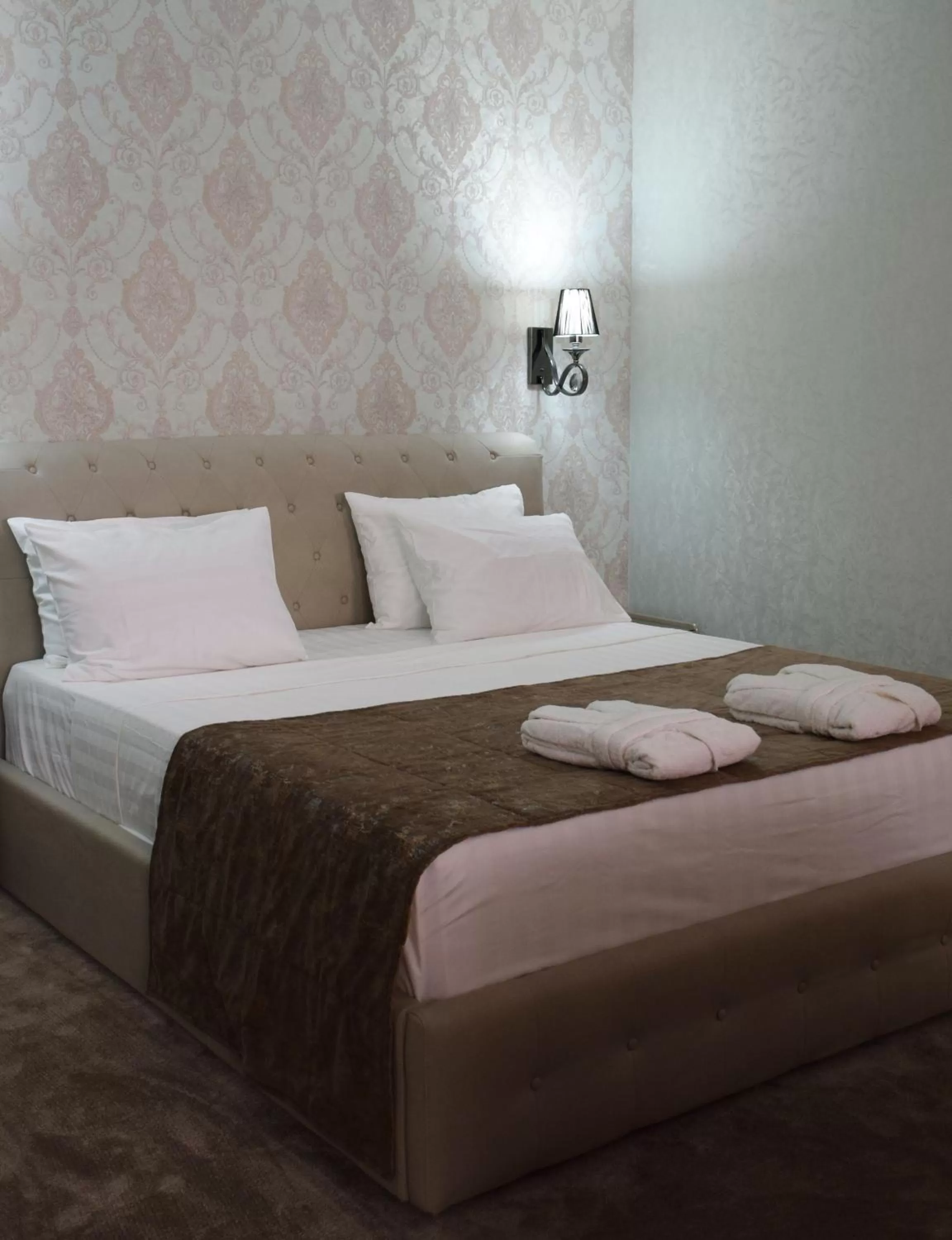 Bed in MirOtel Hotel