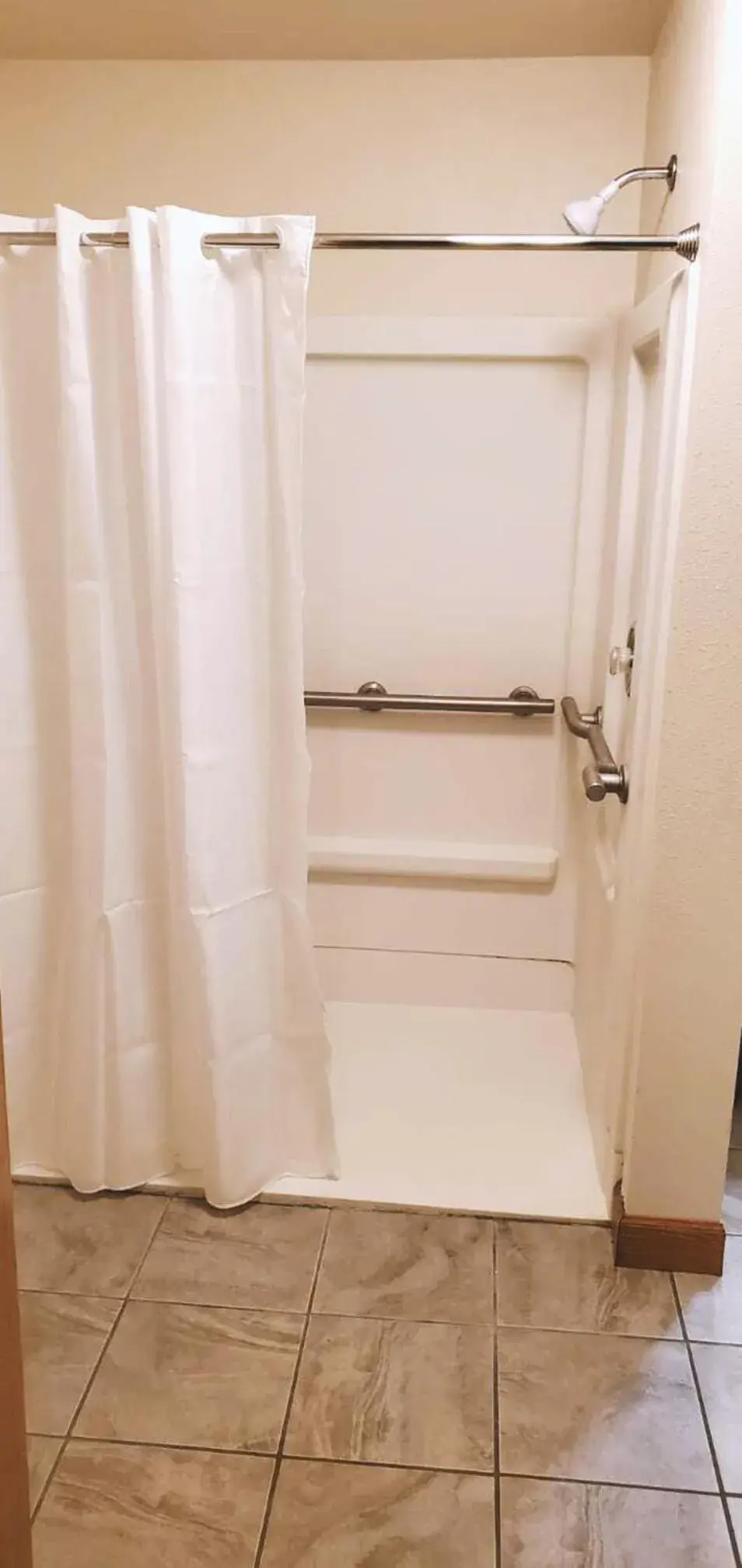 Shower, Bathroom in Coratel Inn & Suites by Jasper McCook