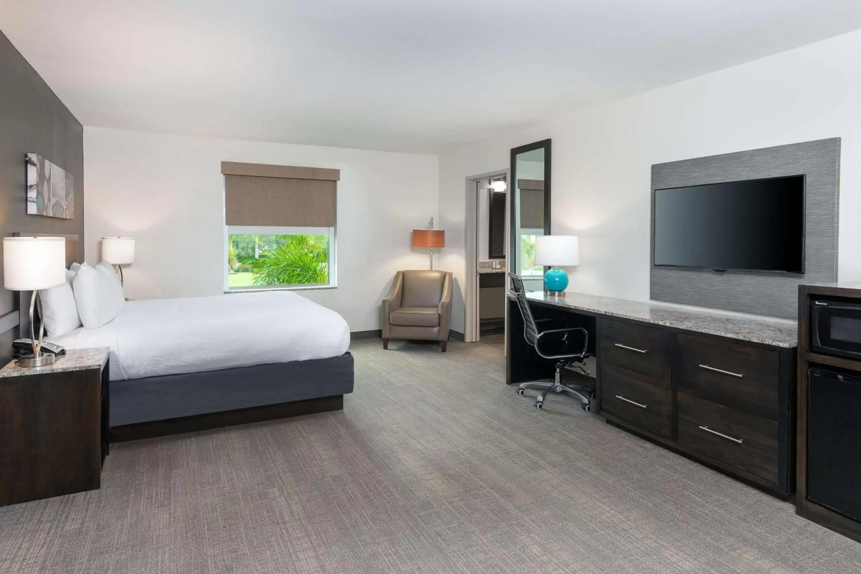 Bedroom, TV/Entertainment Center in Magnolia Pointe; BW Signature Collection