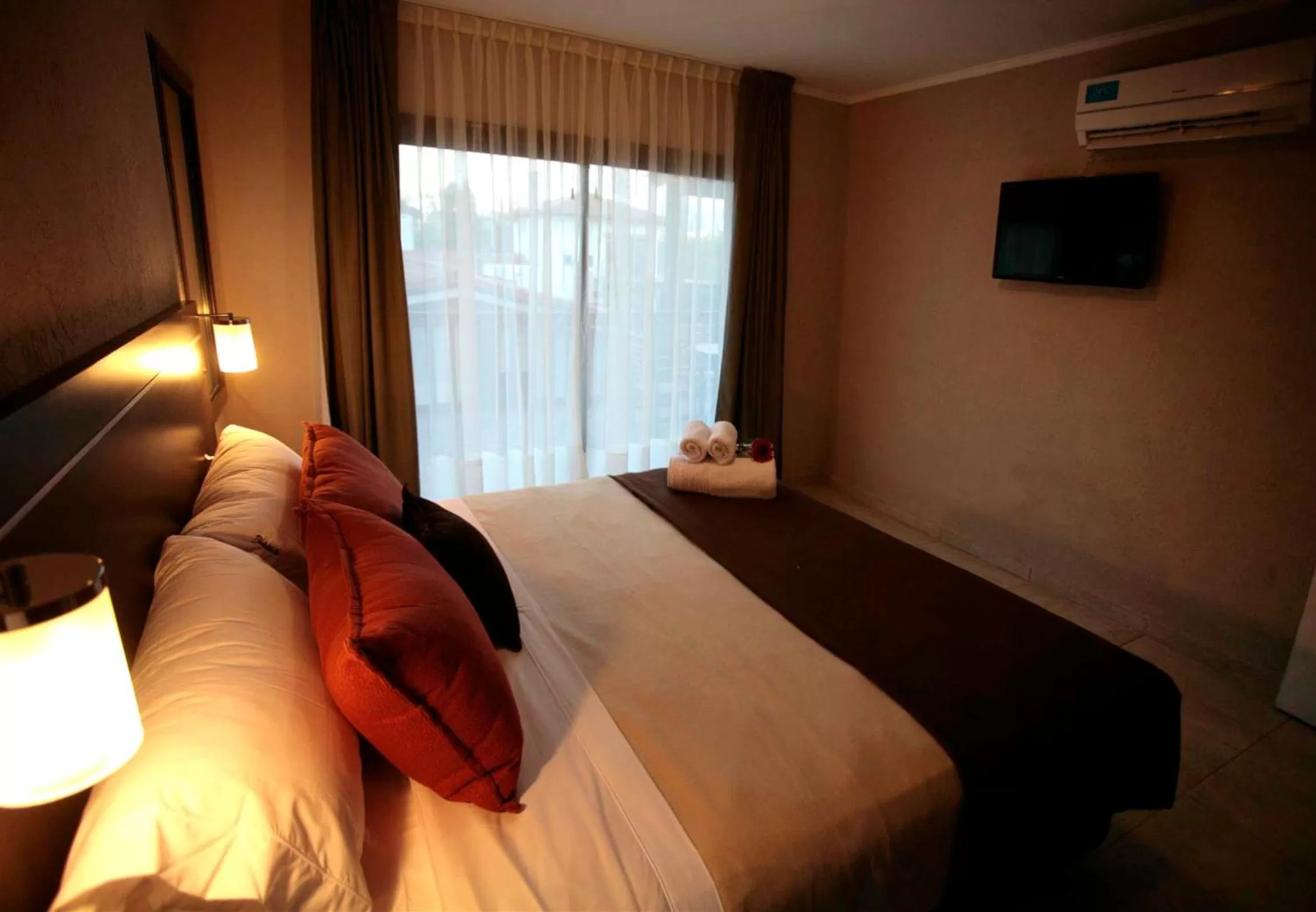 Bed in BlackStone Apart Boutique Hotel