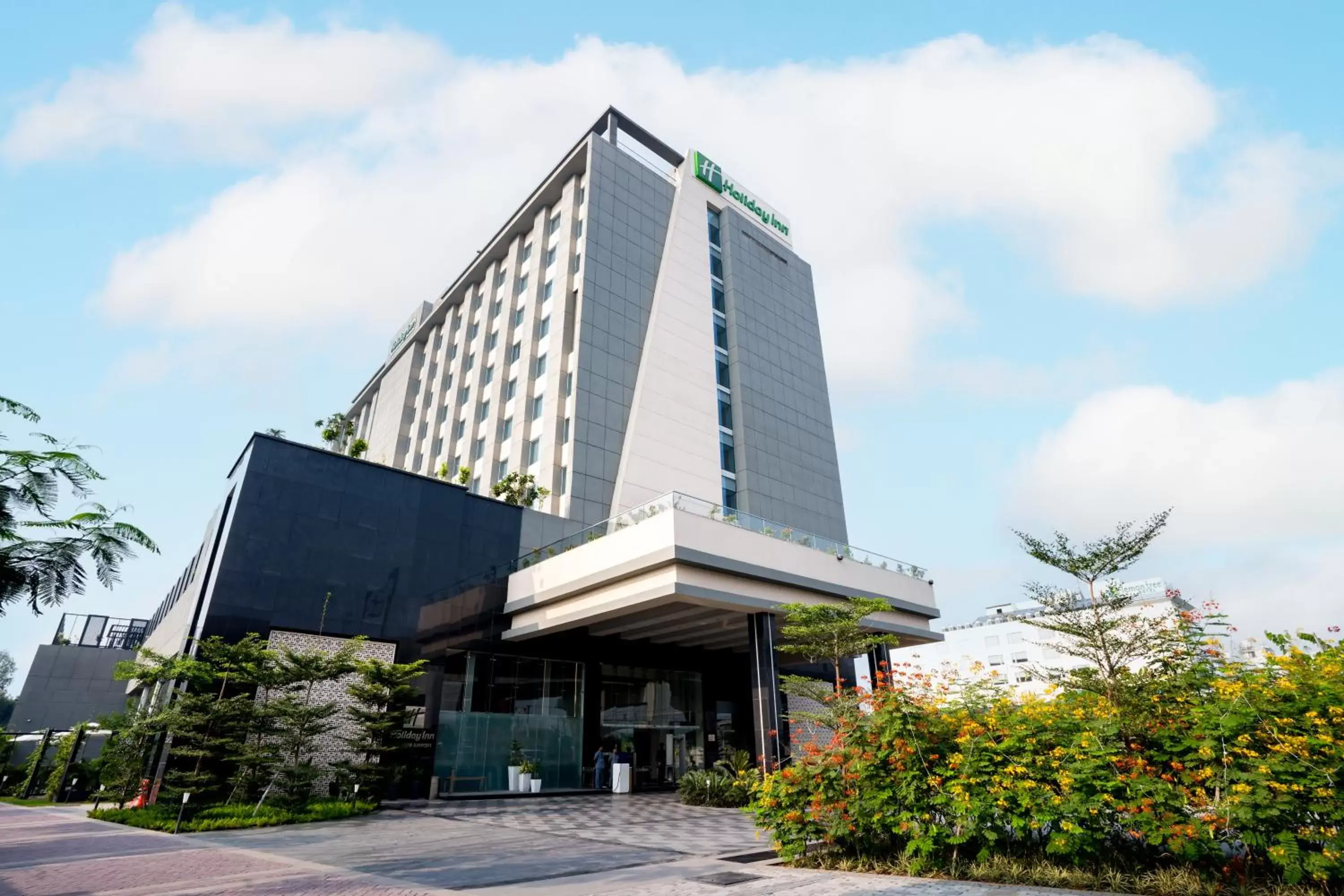 Facade/entrance, Property Building in Holiday Inn Lucknow Airport, an IHG Hotel