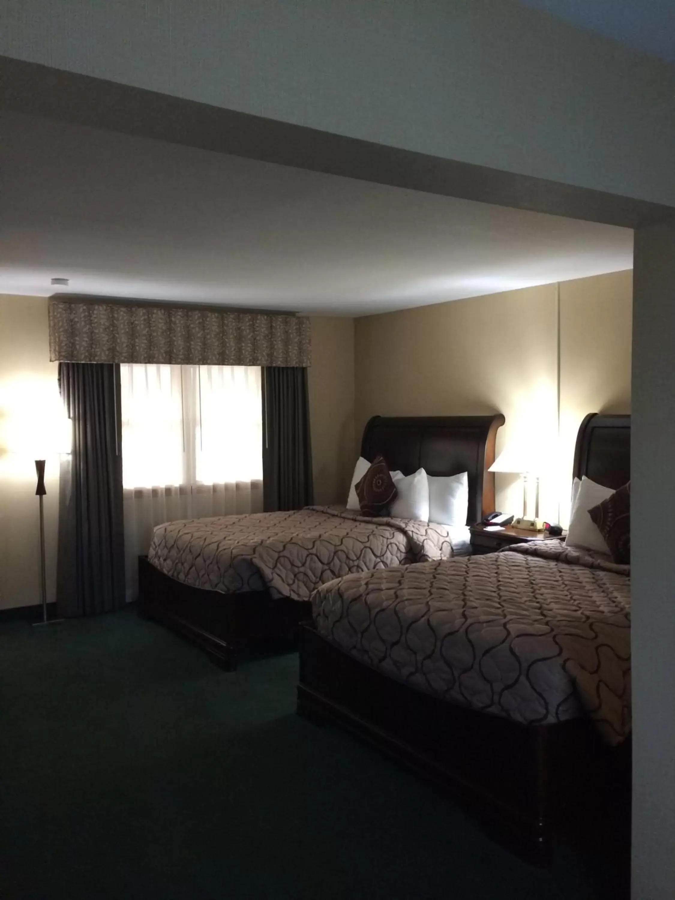 Bed in Pacer Inn & Suites Motel