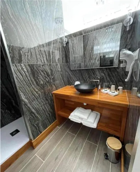 Bathroom in Logis Le Mouton Blanc