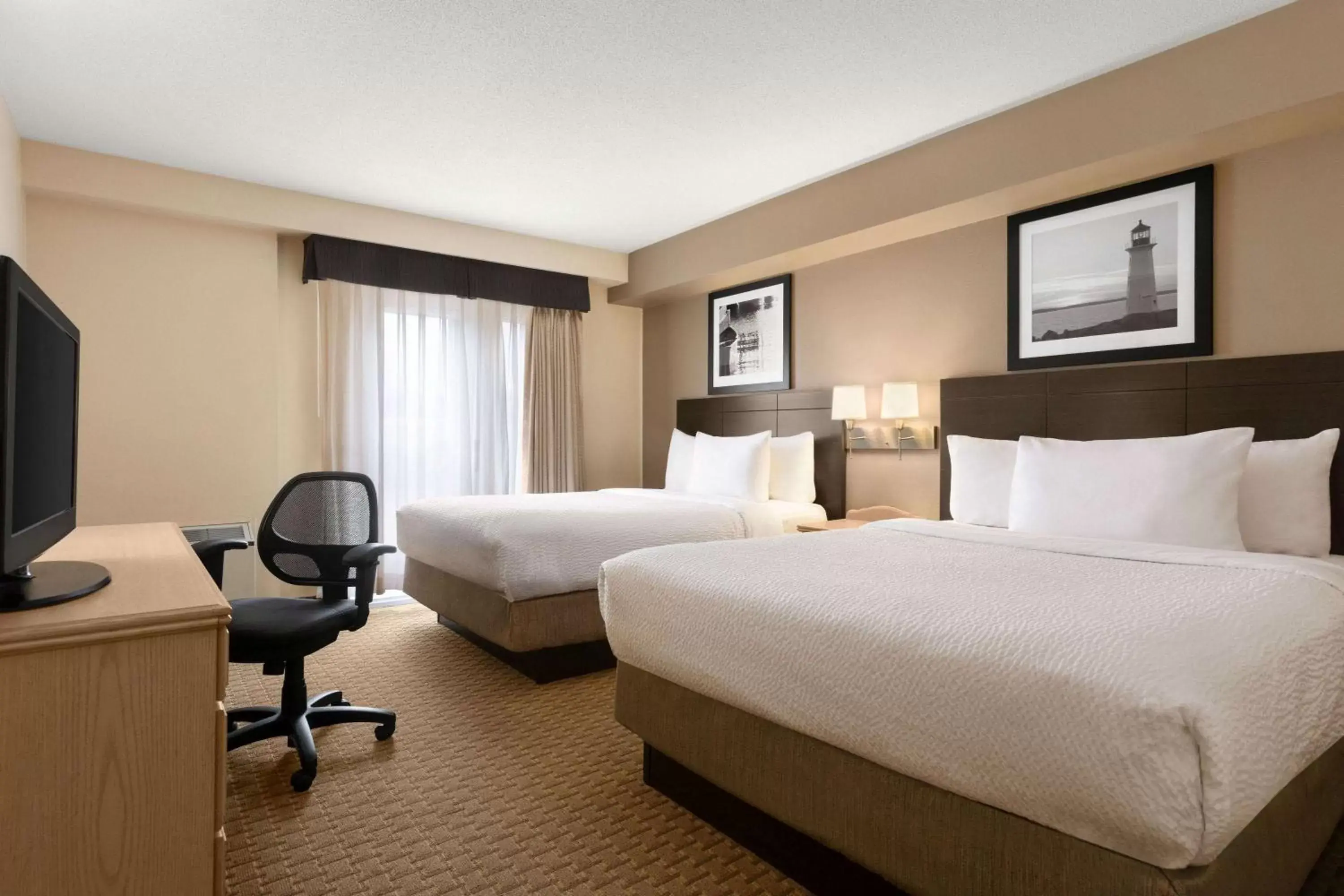 Photo of the whole room in Travelodge Suites by Wyndham Moncton