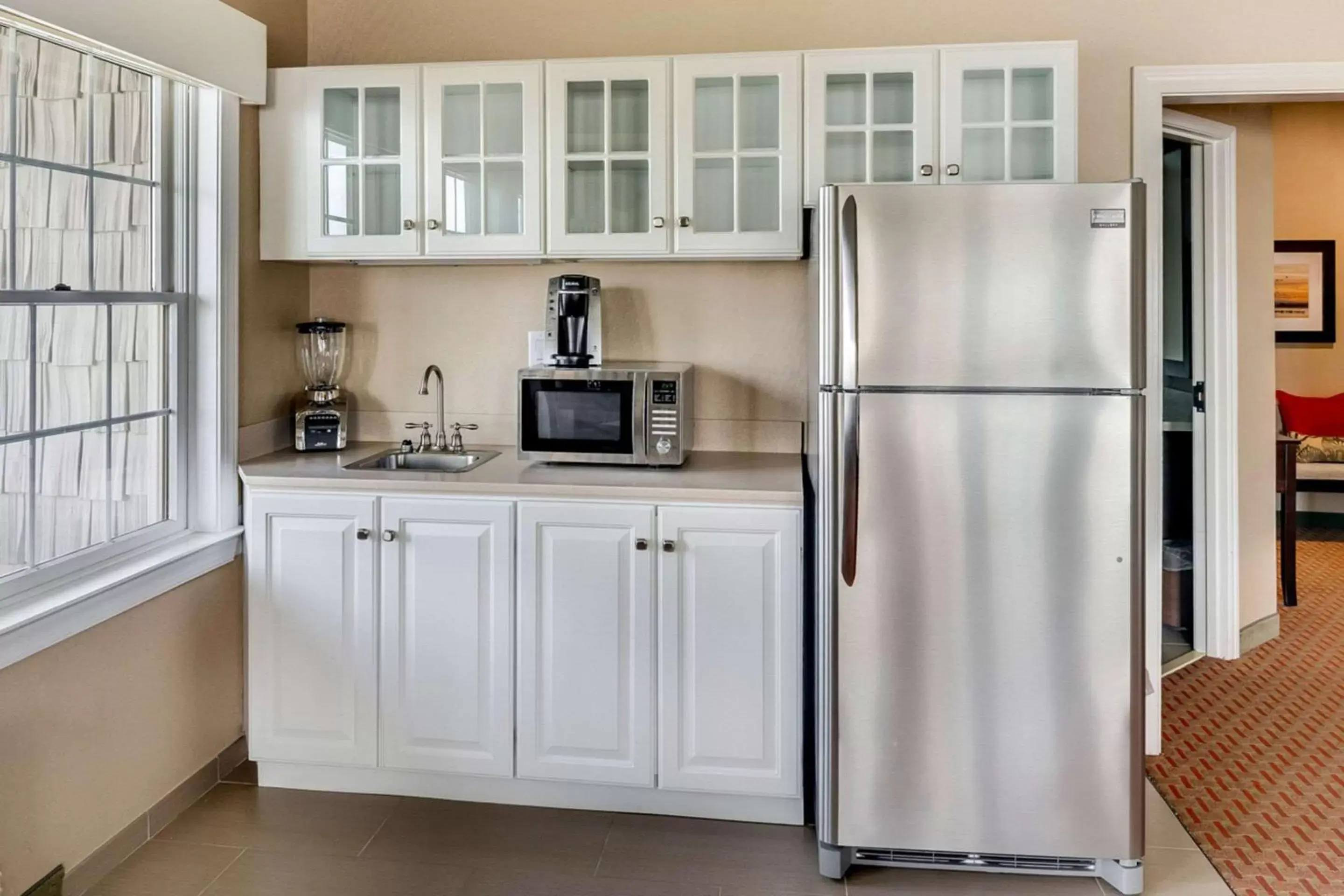 Photo of the whole room, Kitchen/Kitchenette in Comfort Suites Chincoteague Island Bayfront Resort