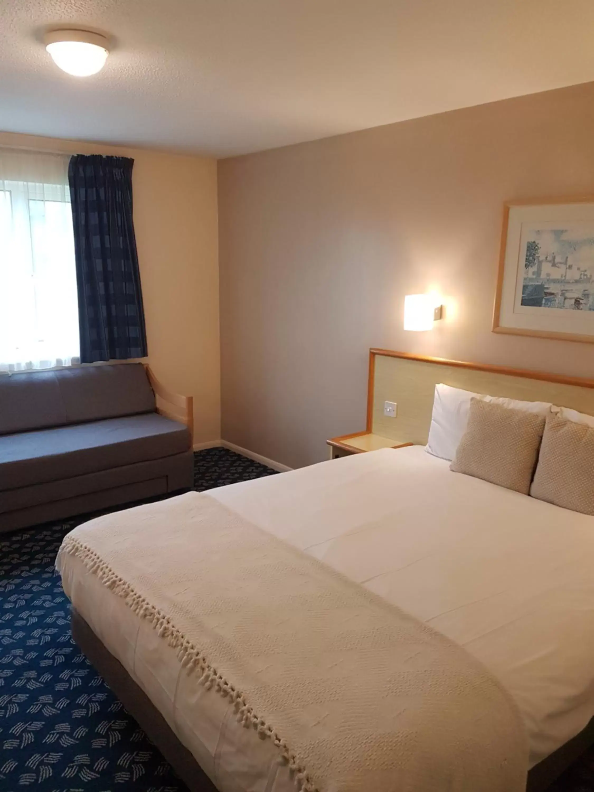 Photo of the whole room, Bed in Travel Plaza Hotel