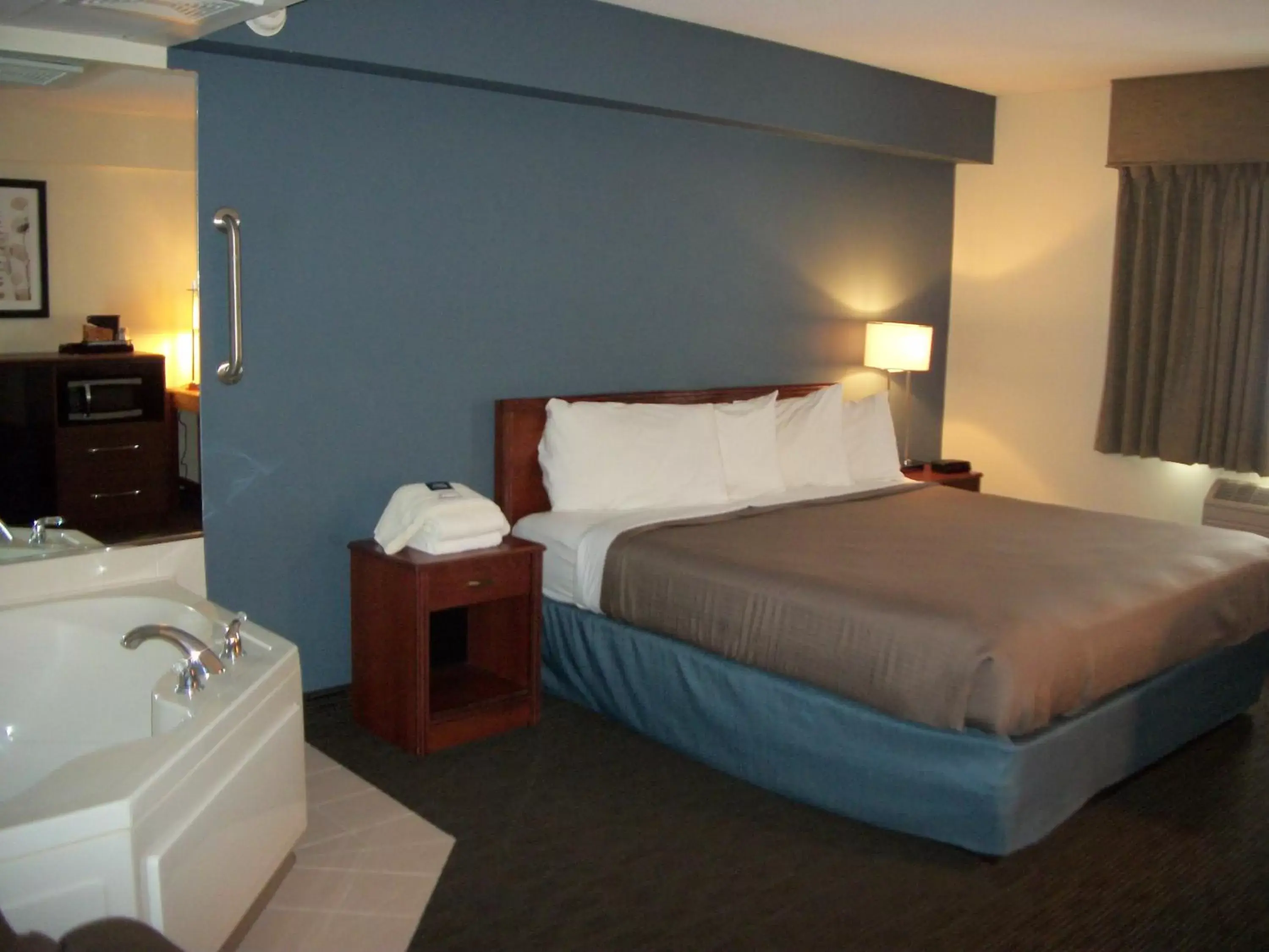 Bed in AmericInn by Wyndham Beulah