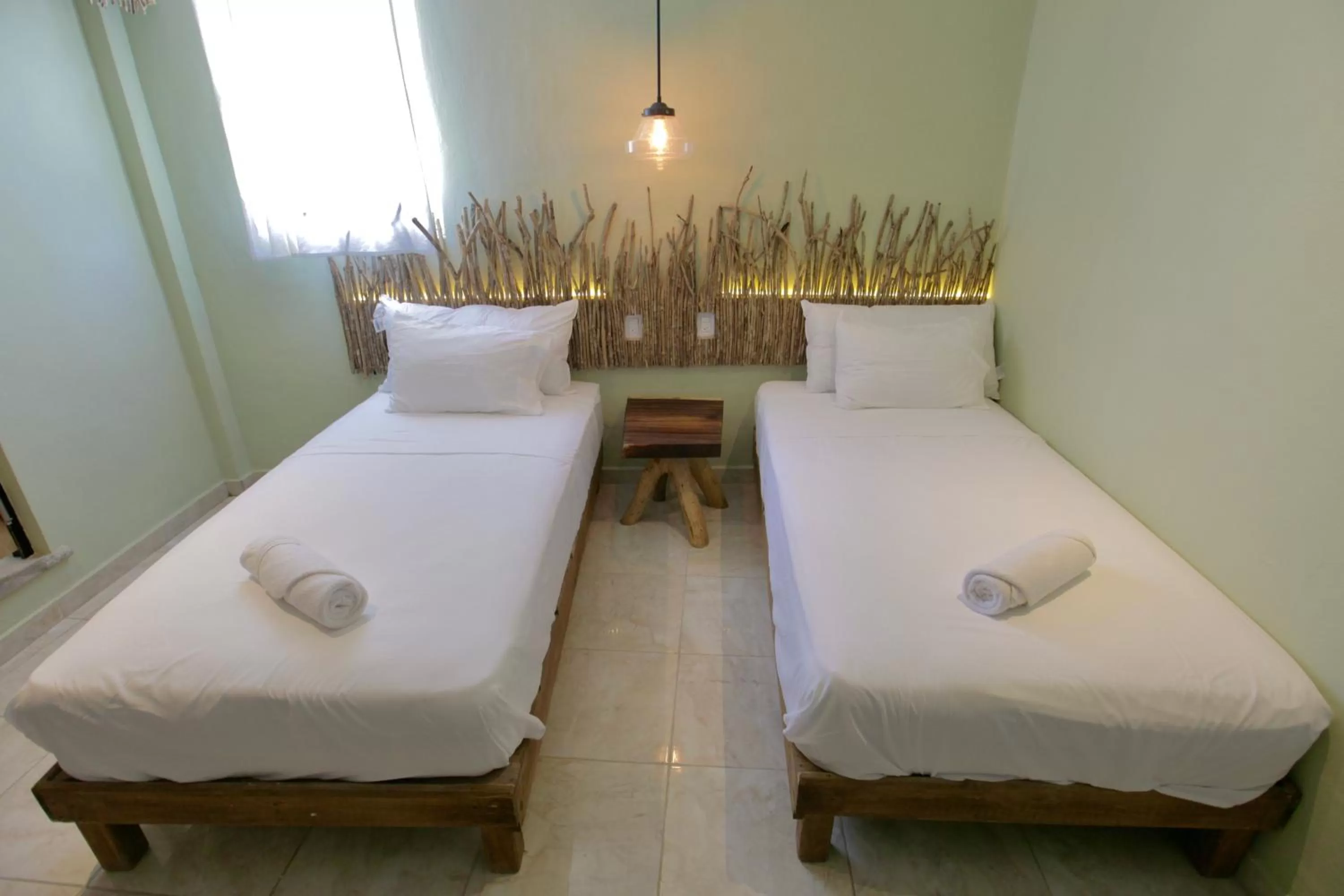 Bed in LA TULUMEÑA Boutique Hotel