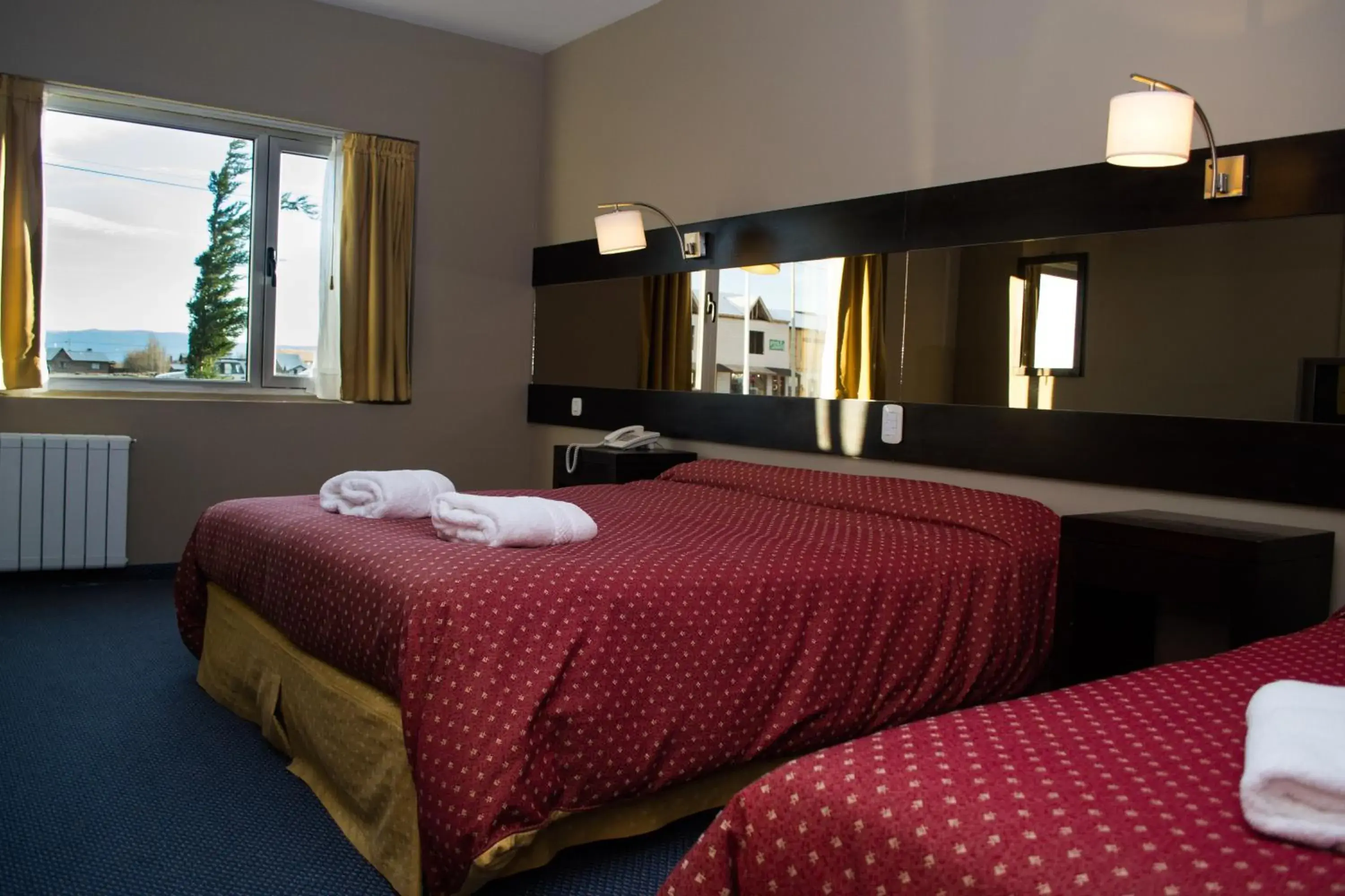 Bed in Marcopolo Suites Calafate