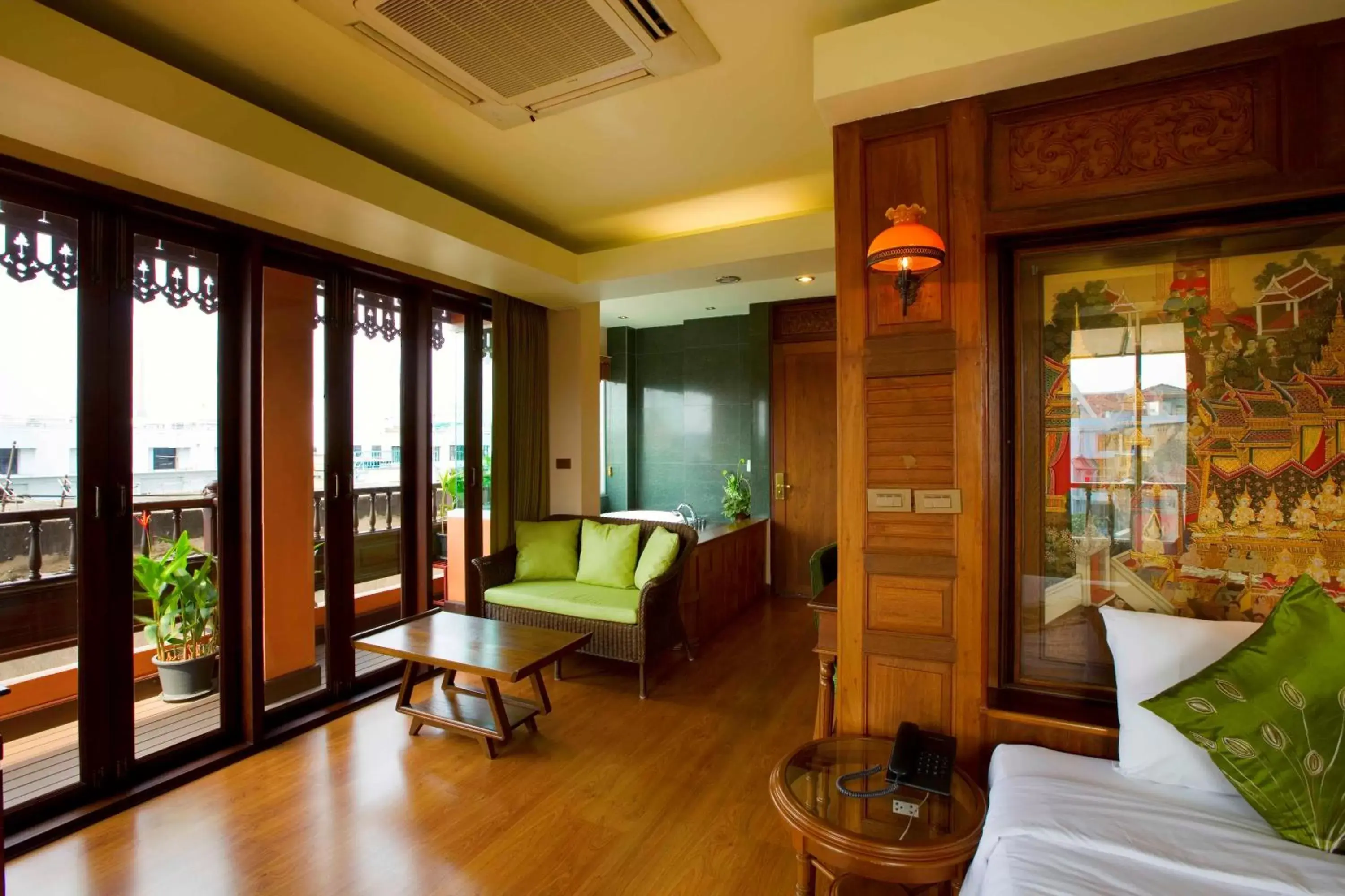 Photo of the whole room, Seating Area in Lamphu Tree House Boutique Hotel