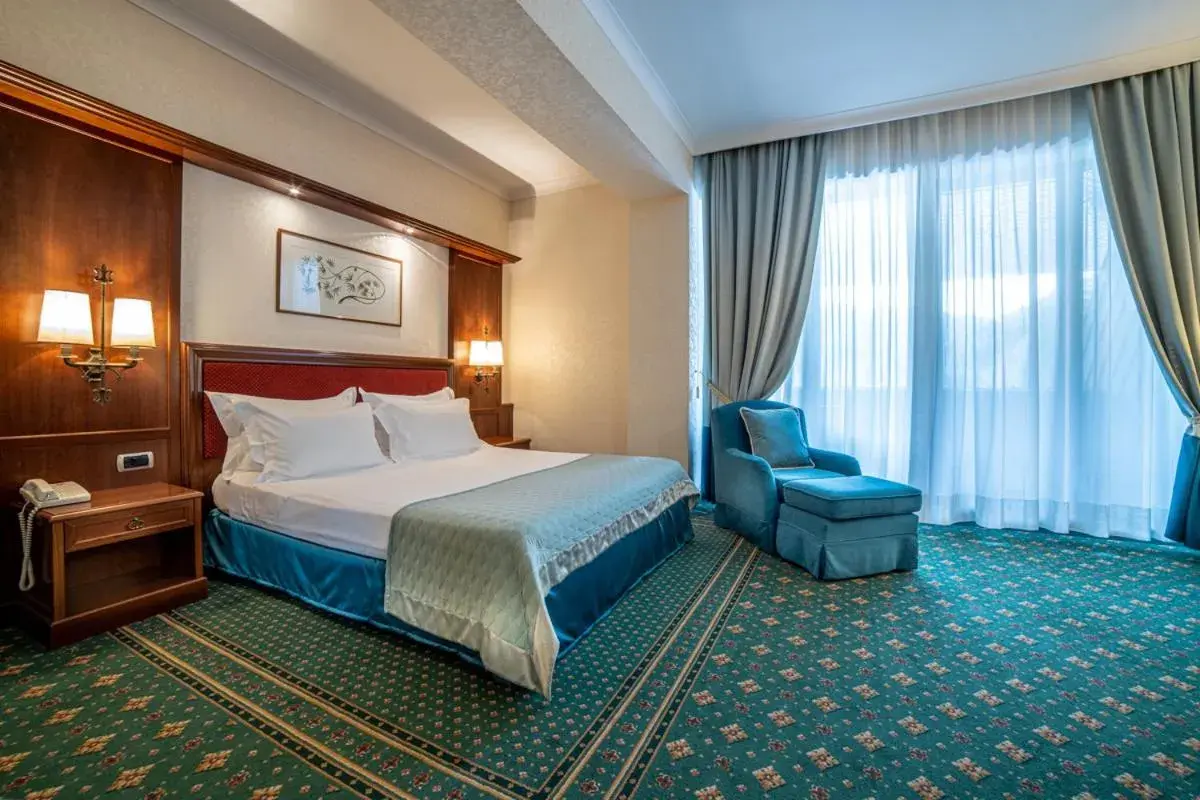 Bed in Lux Garden Hotel