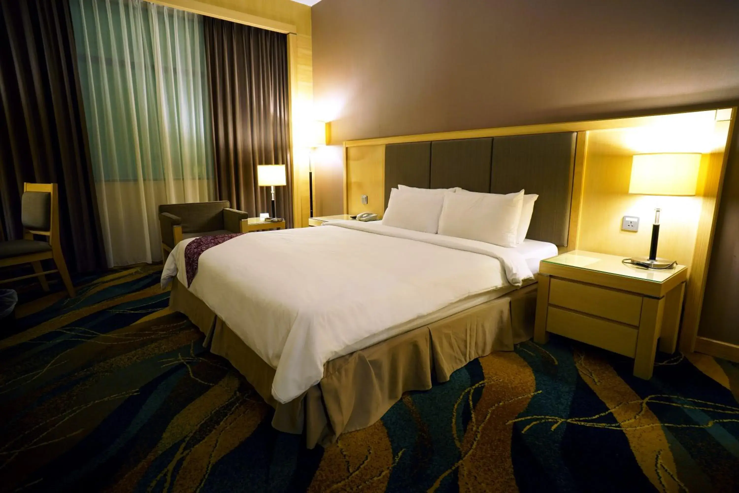 Bed in Imperial Palace Hotel
