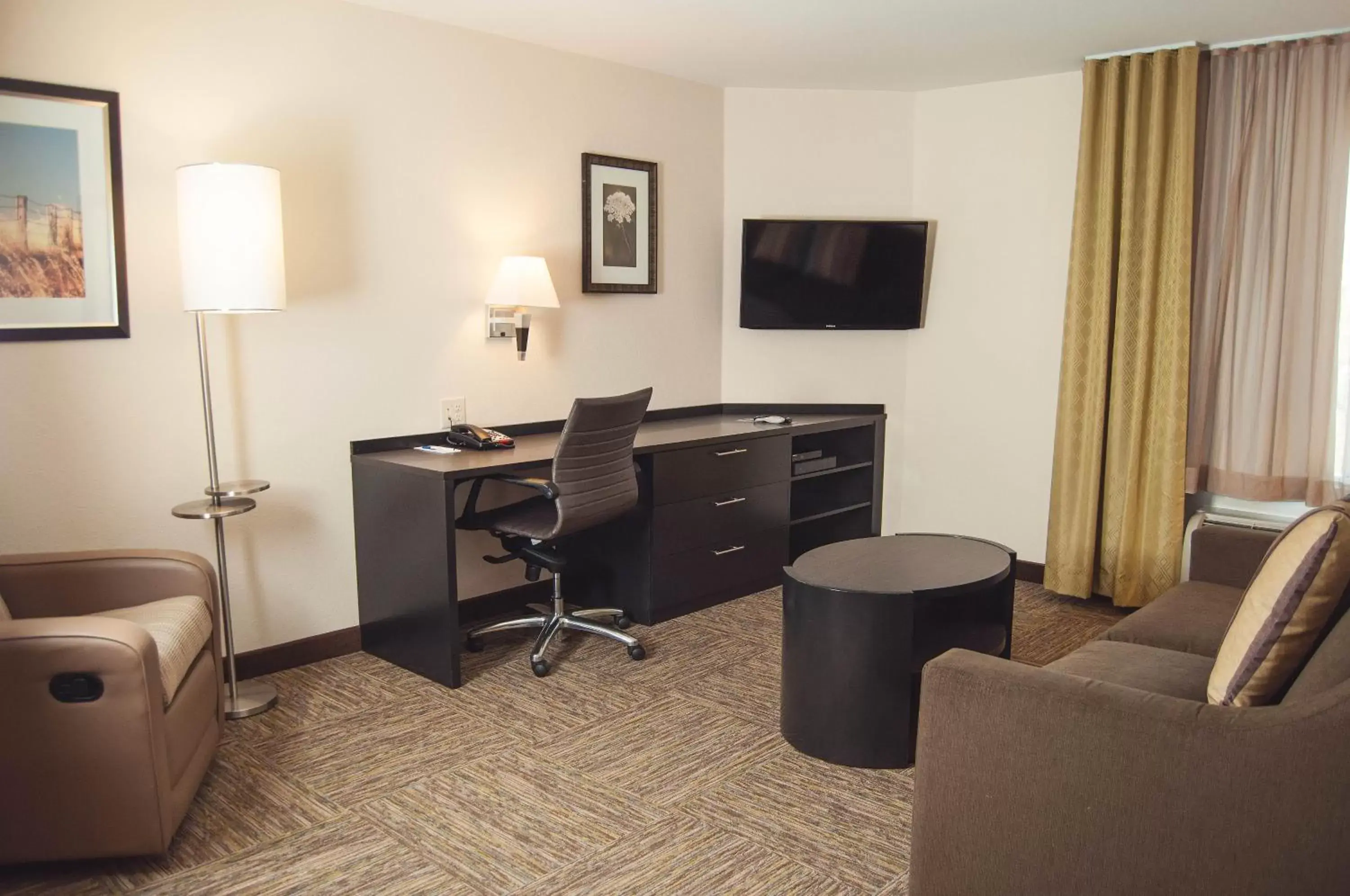 Photo of the whole room, TV/Entertainment Center in Candlewood Suites Denver North - Thornton, an IHG Hotel