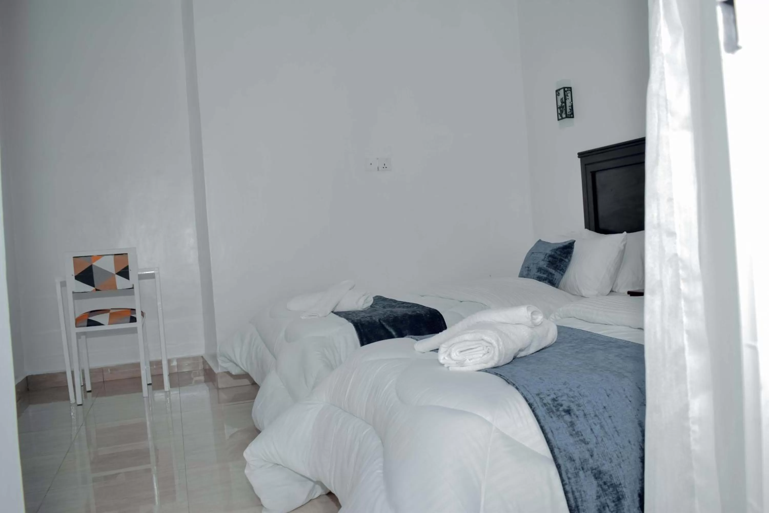 Bed in INZOZI AFRICA HOUSE B&B-Gishushu