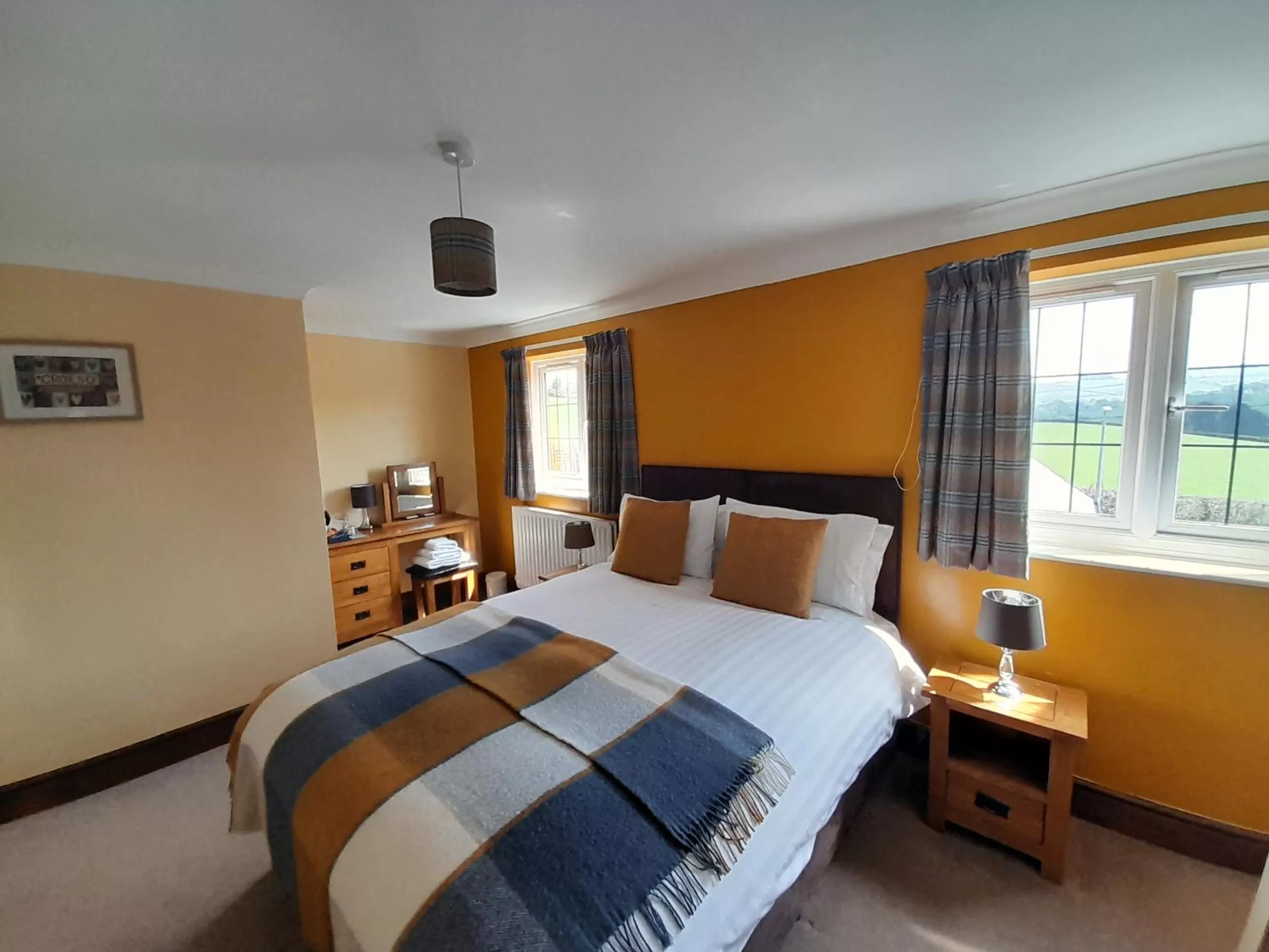 Bed in The Dolfor Inn