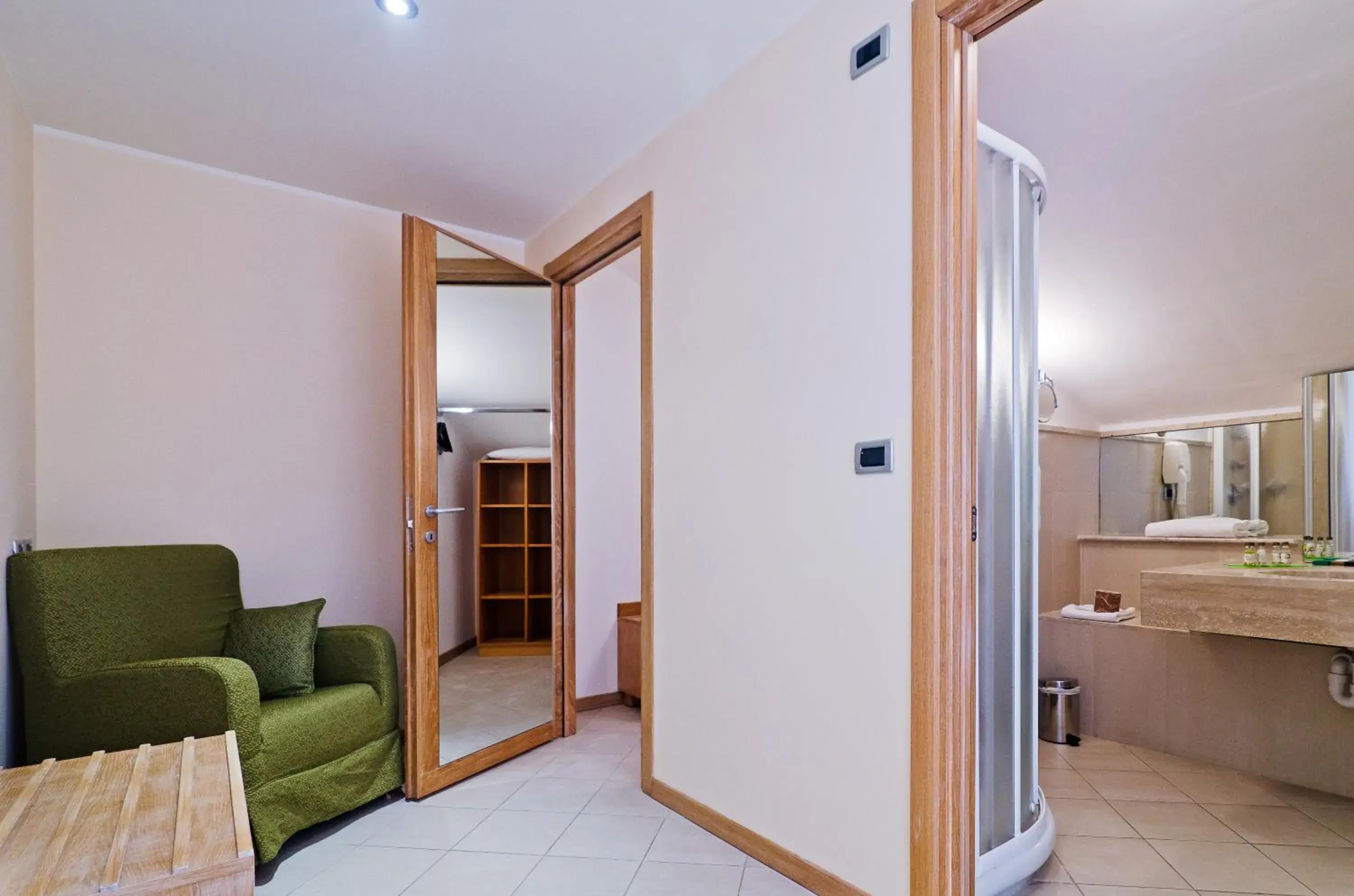 Seating area, Bathroom in Castellaro Golf Resort