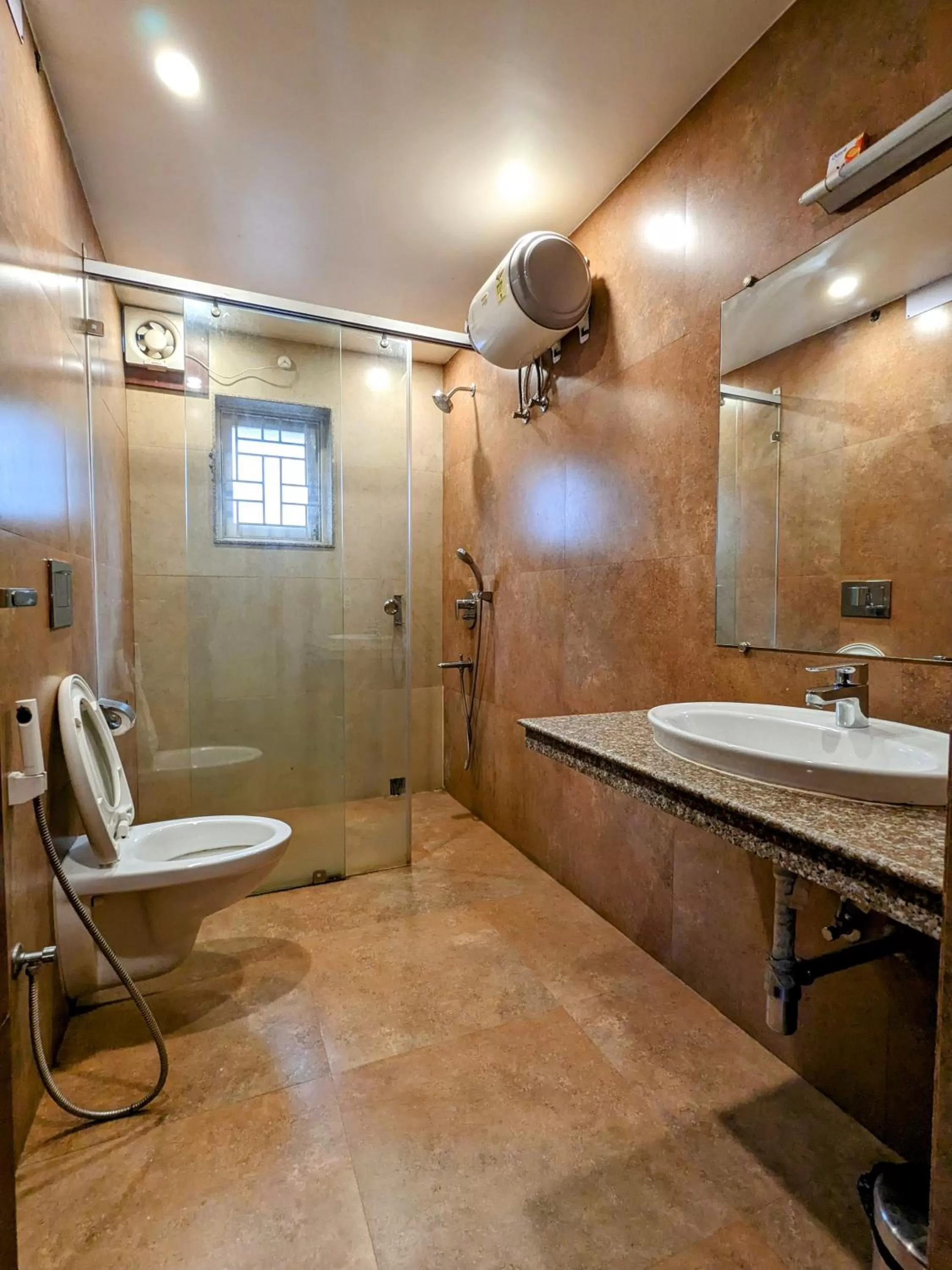Shower in The Aster Enclave Hotel
