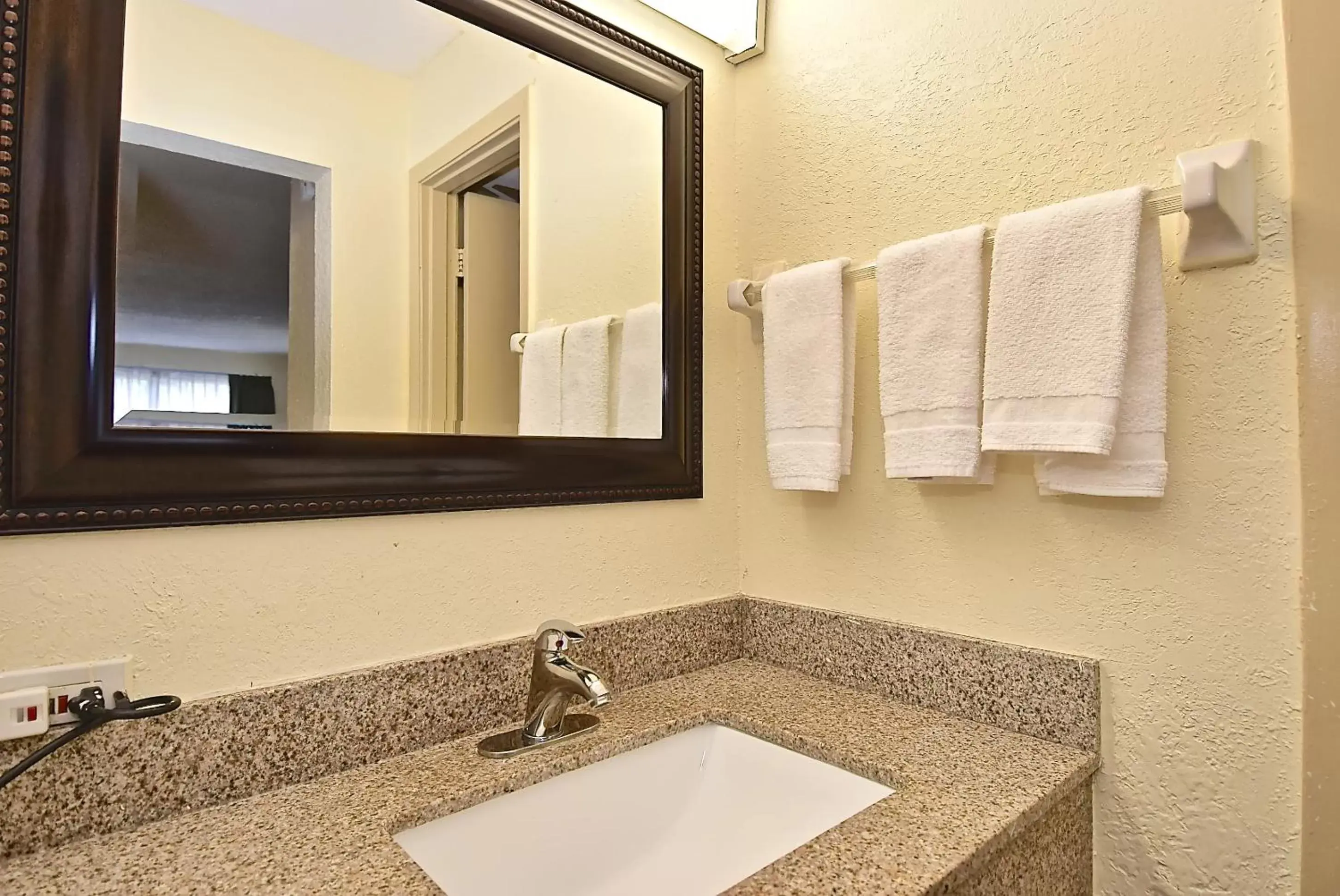 Bathroom in SureStay Hotel by Best Western Sarasota Lido Beach