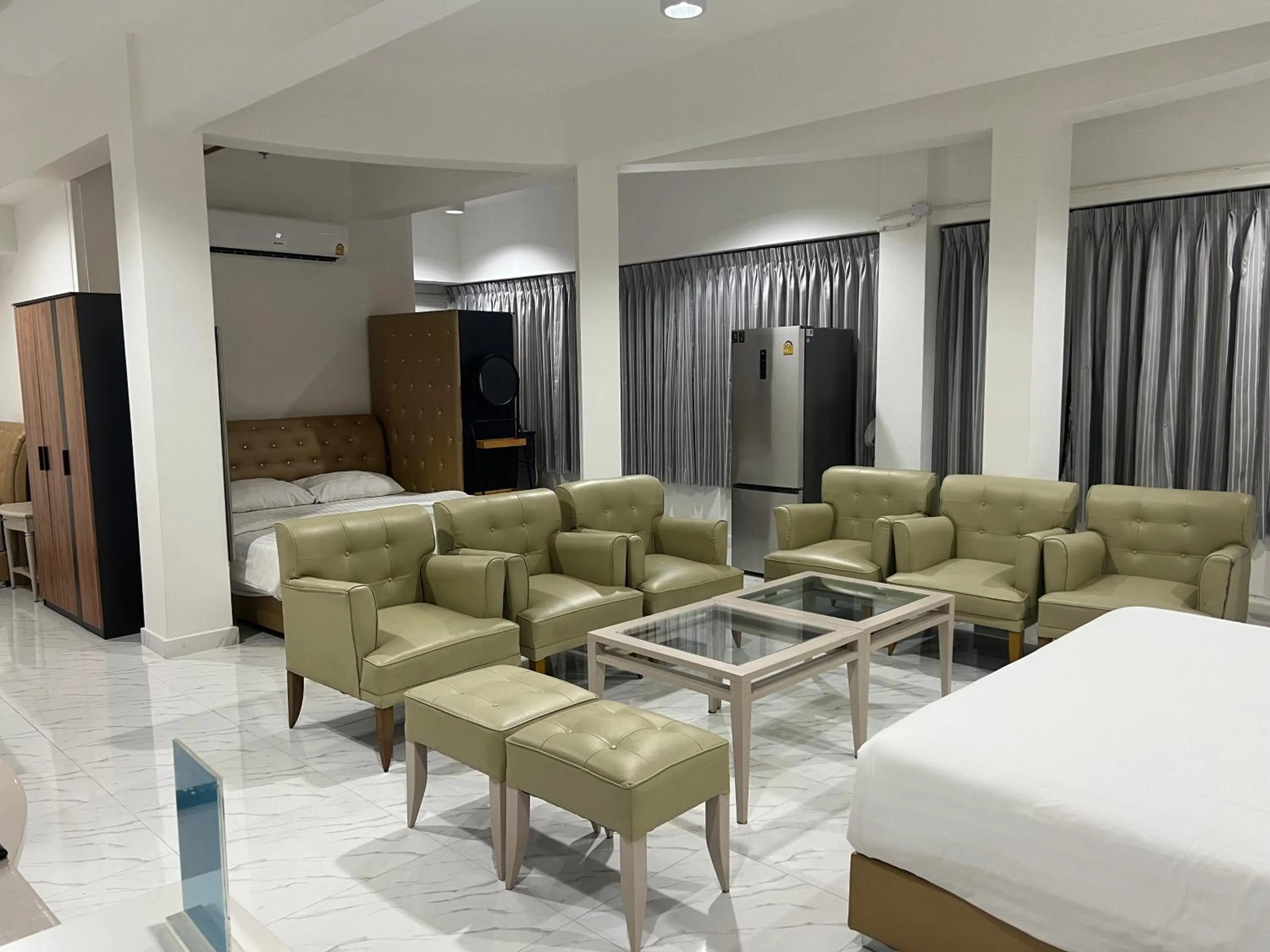 Bed in Mall Suites Hotel