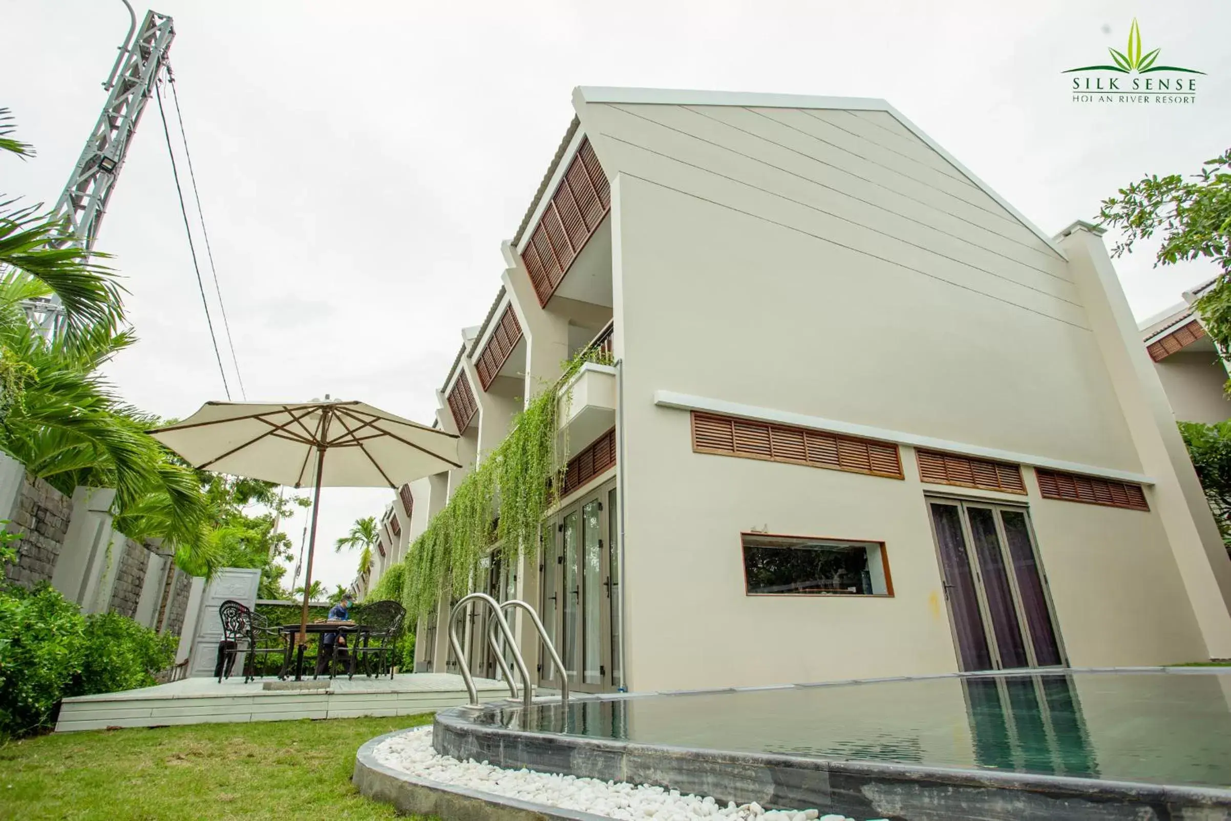 Swimming pool, Property Building in Silk Sense Hoi An River Resort